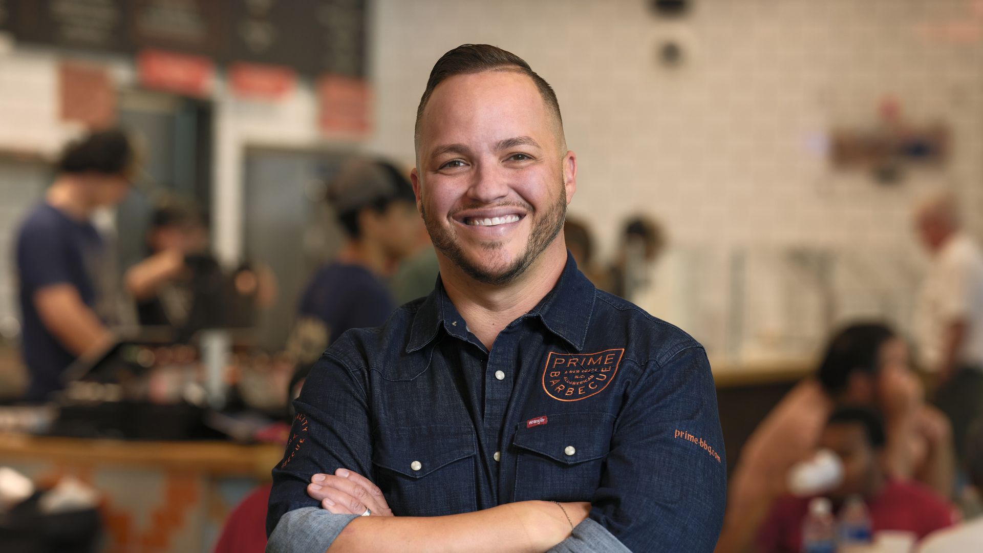 Christopher Prieto stands for a portrait