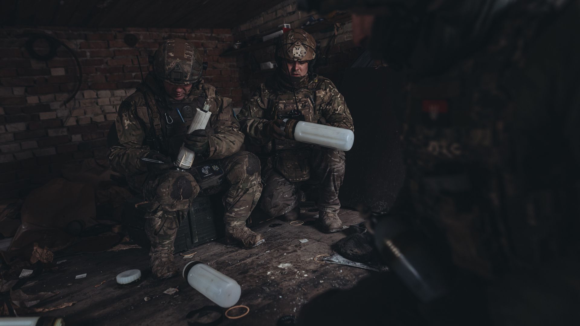 Ukrainian soldiers collect ammunition on the Donbass frontline, in Donetsk Oblast, Ukraine on January 16.