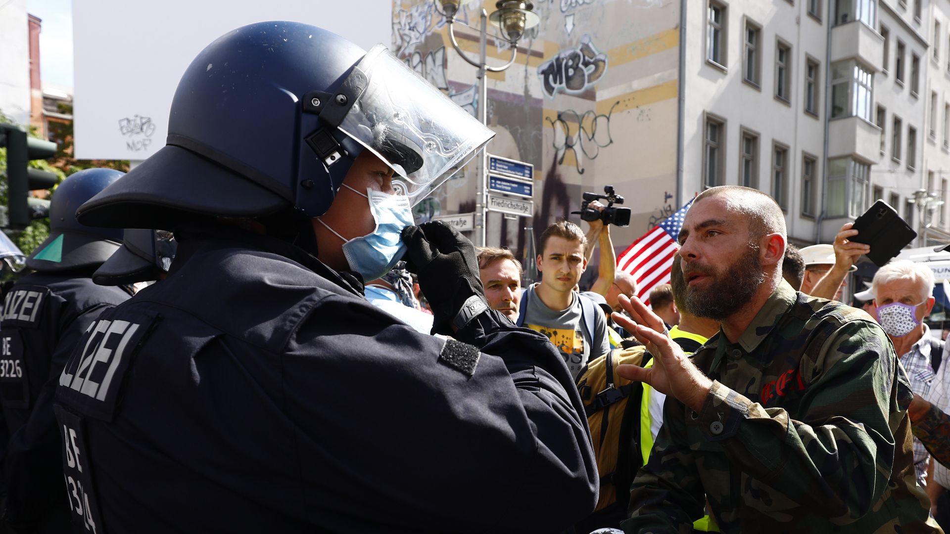 A protester confronting a police officer in Berlin on Aug. 28.