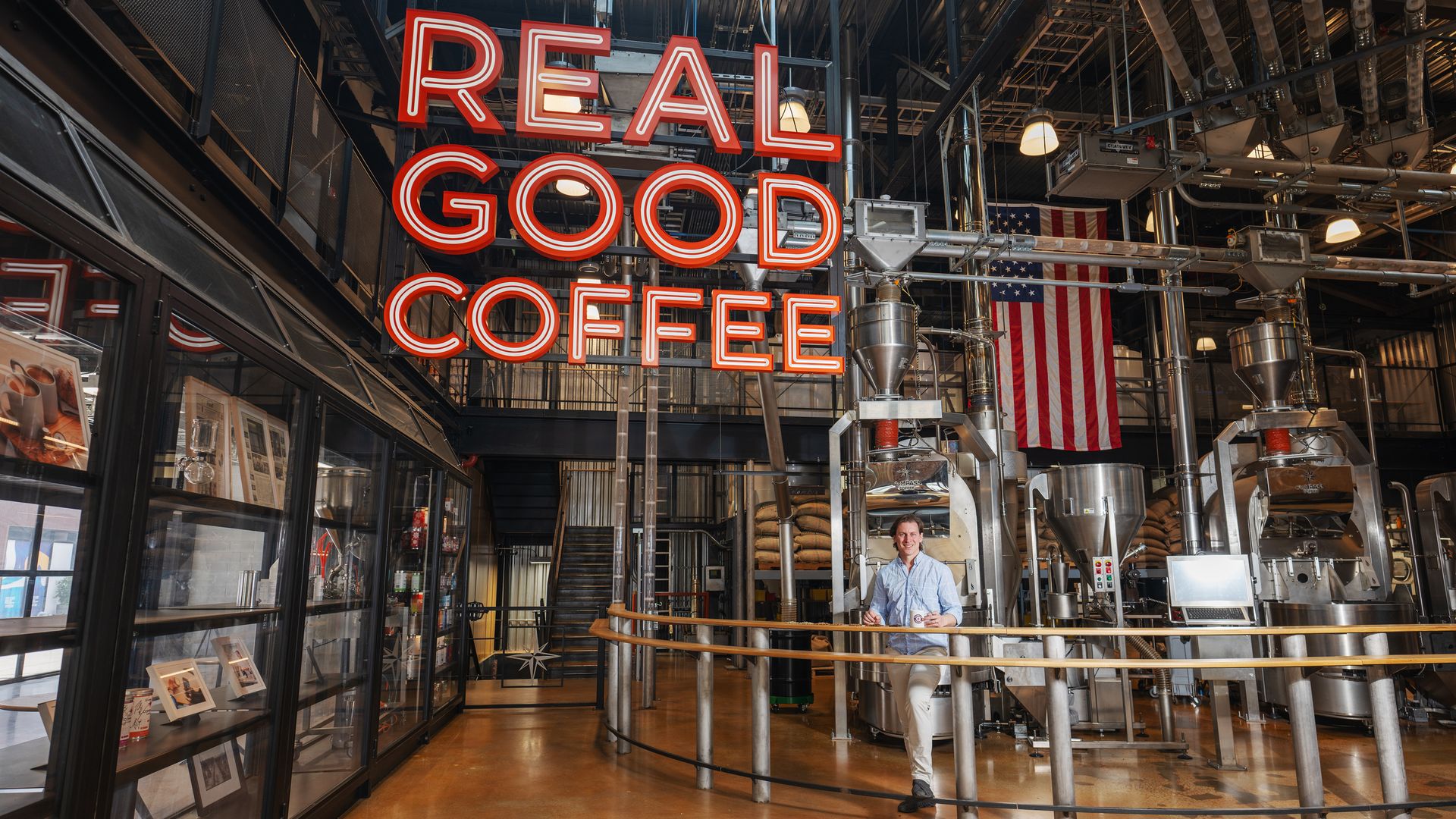 Michael Haft stands inside Compass Coffee's roastery in D.C.