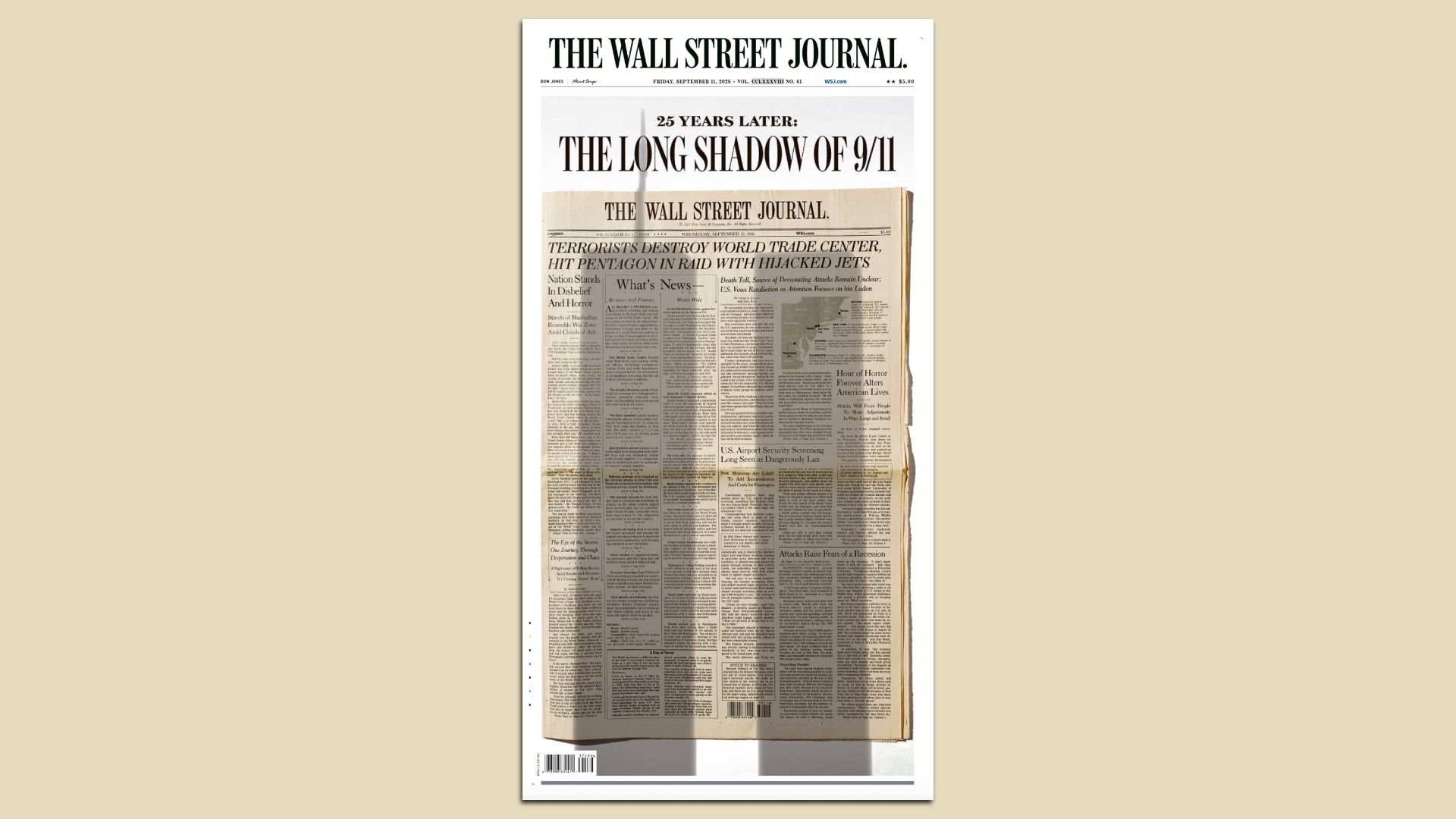 Framed front page of The Wall Street Journal showing the headline "25 YEARS LATER: THE LONG SHADOW OF 9/11" over a second WSJ page, on a beige background.