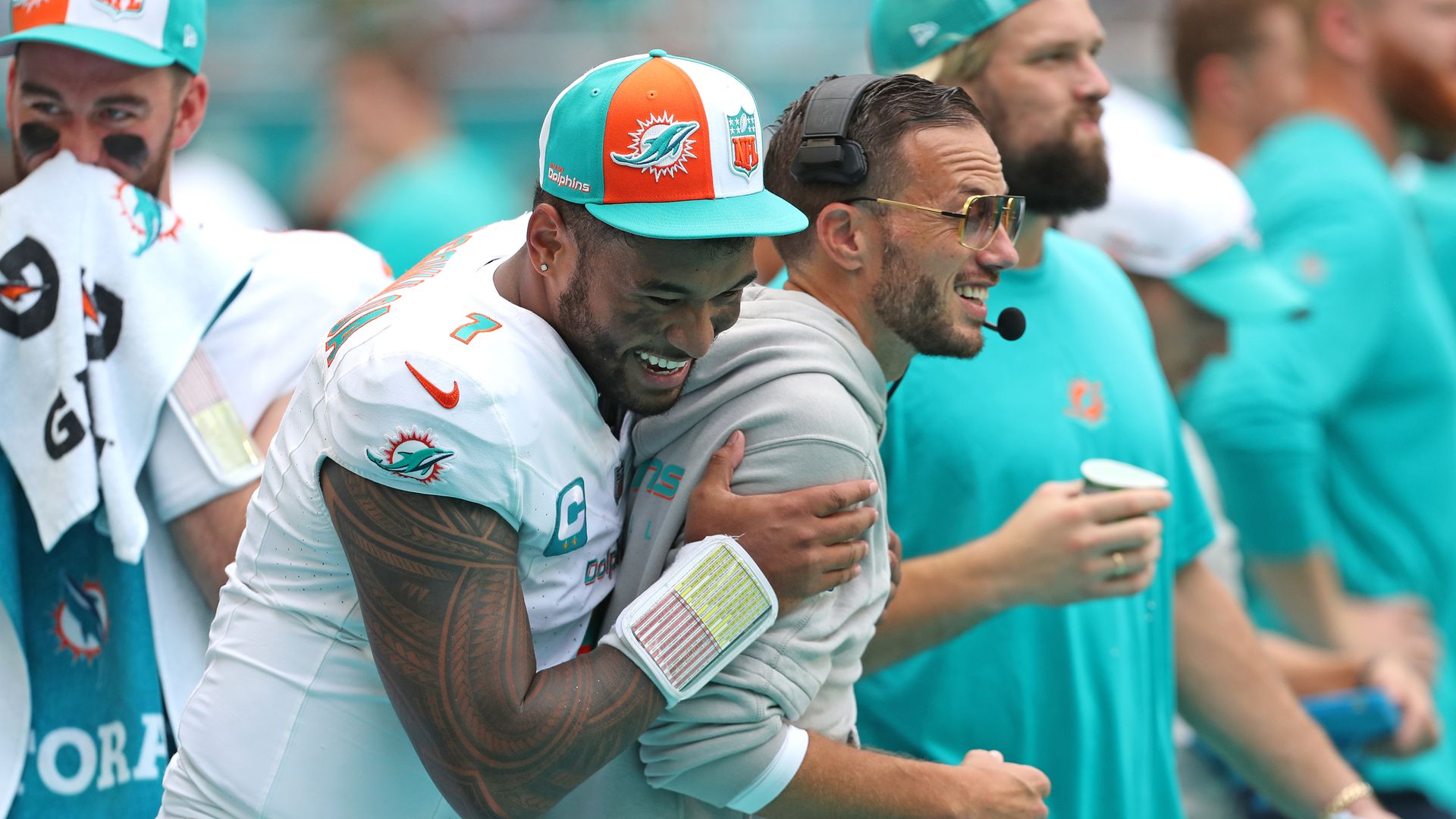 Dolphins quarterback Tua Tagovailoa celebrates with coach Mike McDaniel.