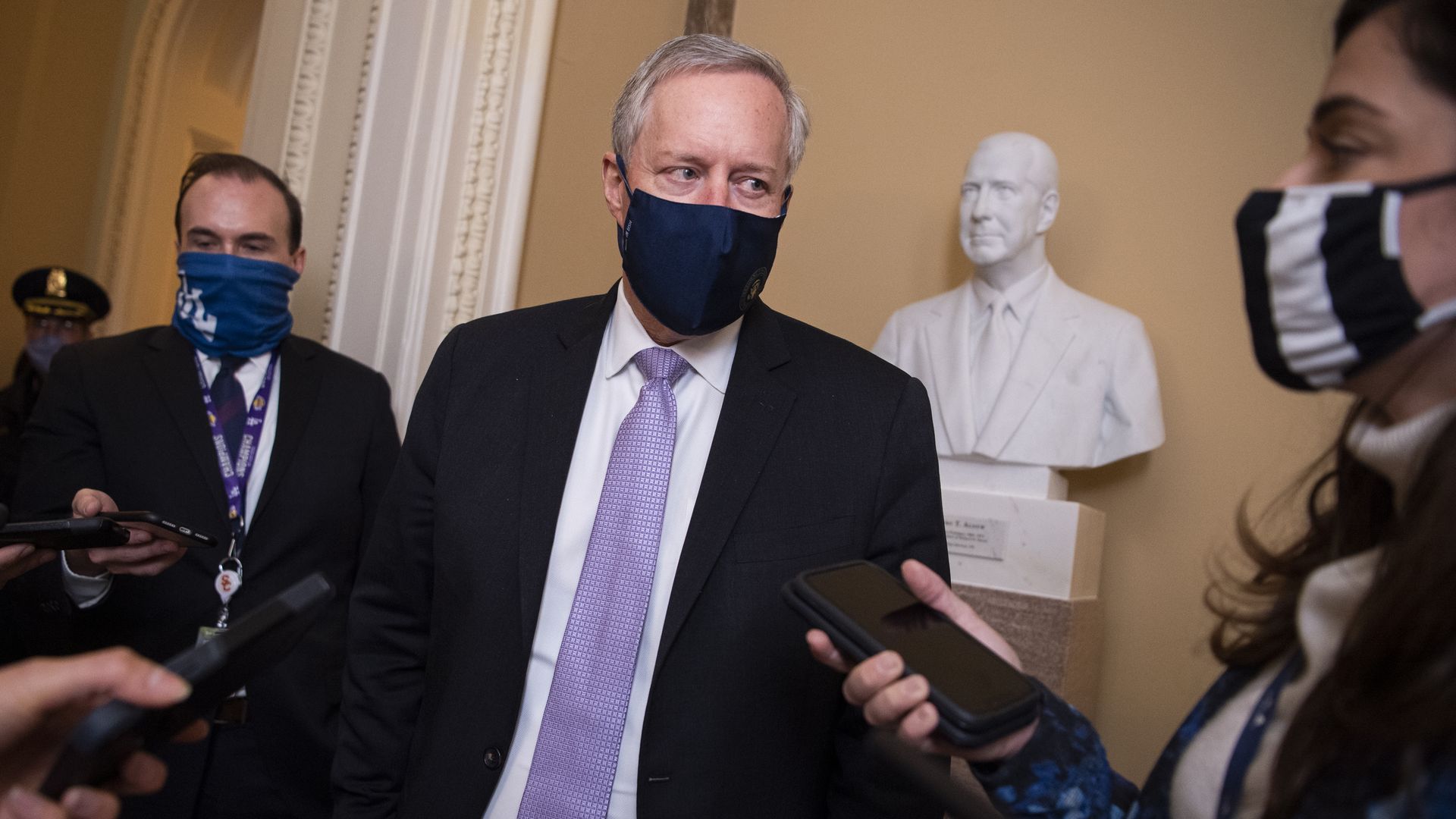 Photo of Mark Meadows in a mask speaking with reporters