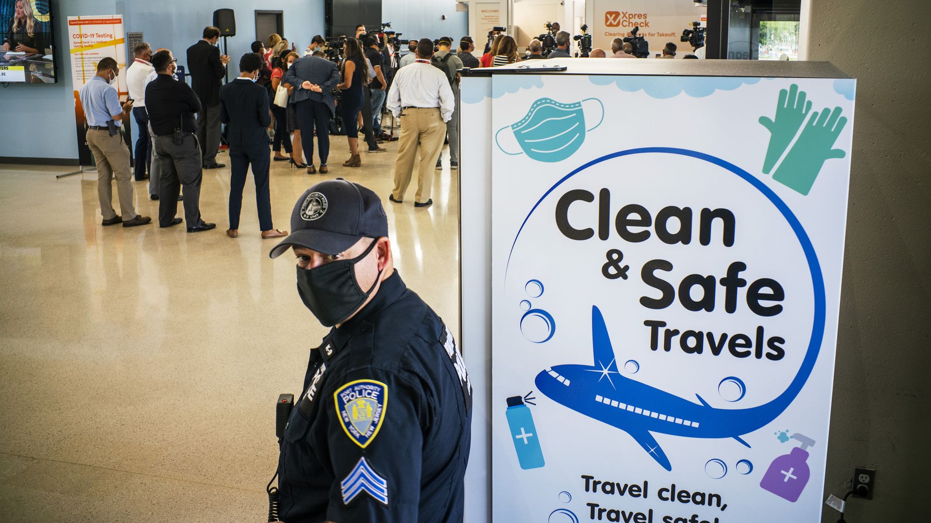 A Port Authority police officer stands watch at Newark Liberty International Airport