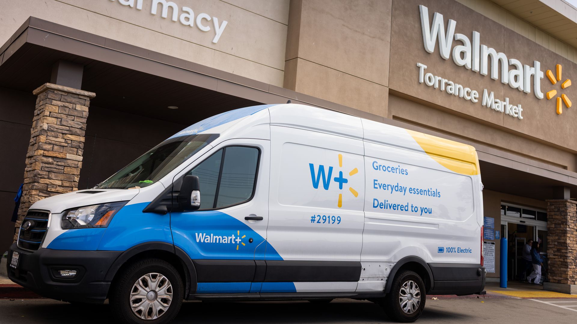 Walmart storefront with Walmart delivery van in front