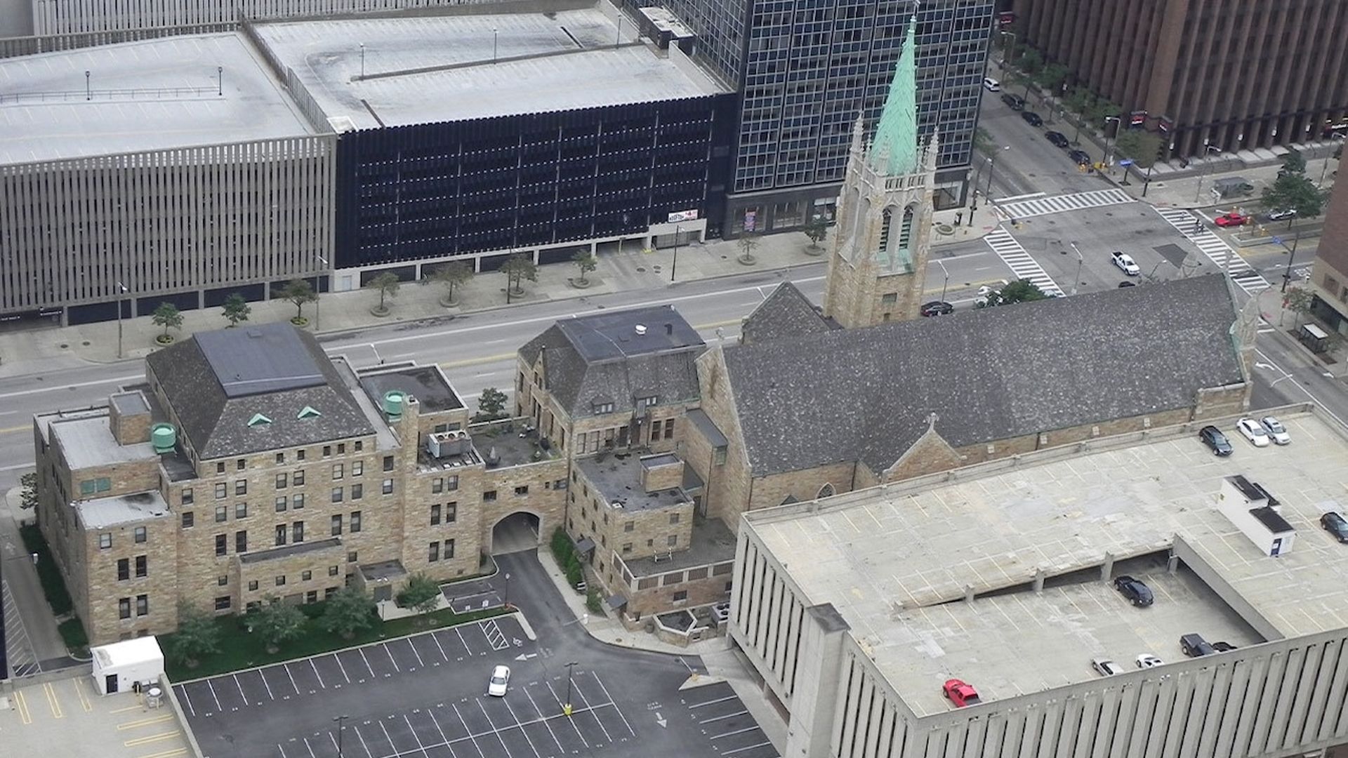 Overhead view of a sandstone office building next to a Cathedral