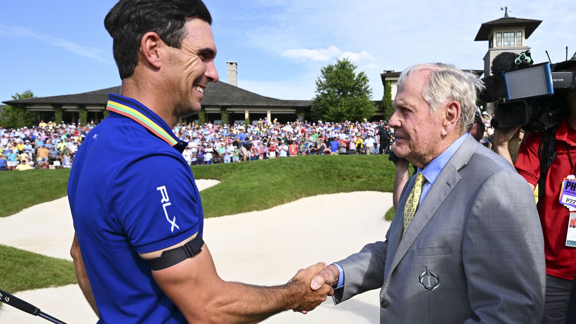 Billy Horschel and Jack Nicklaus shake hands after Billy won the Memorial Golf Tournament. 