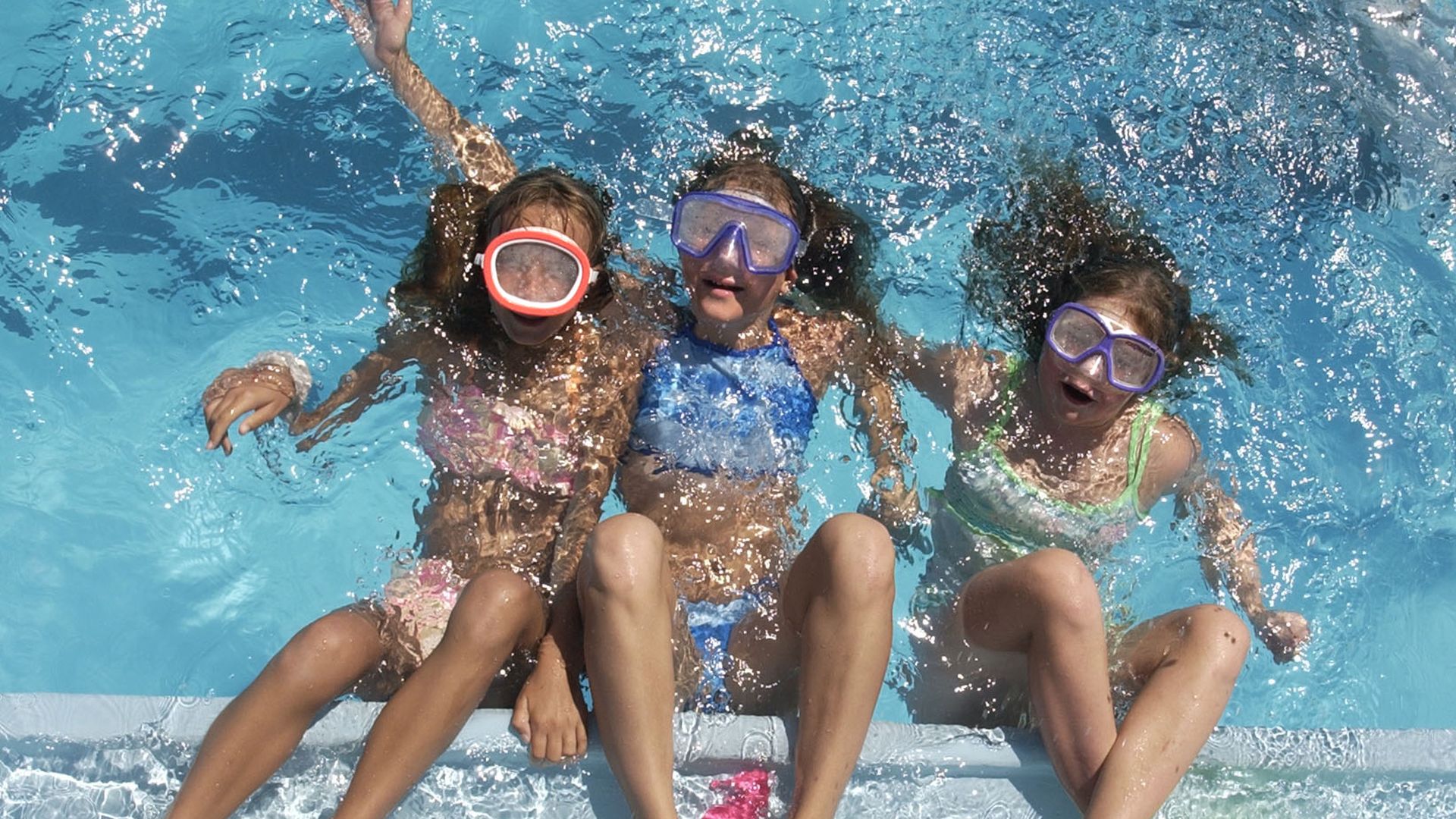 A photo of girls swimming at Cook Park Pool in Denver. 