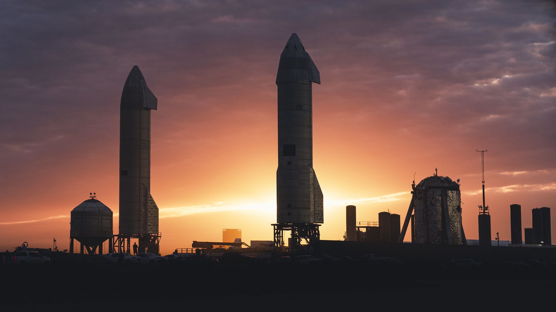 Rockets framed against a setting Sun