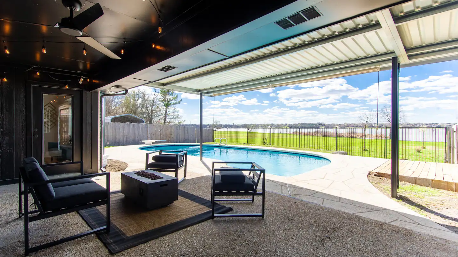 A backyard pool on the lakefront