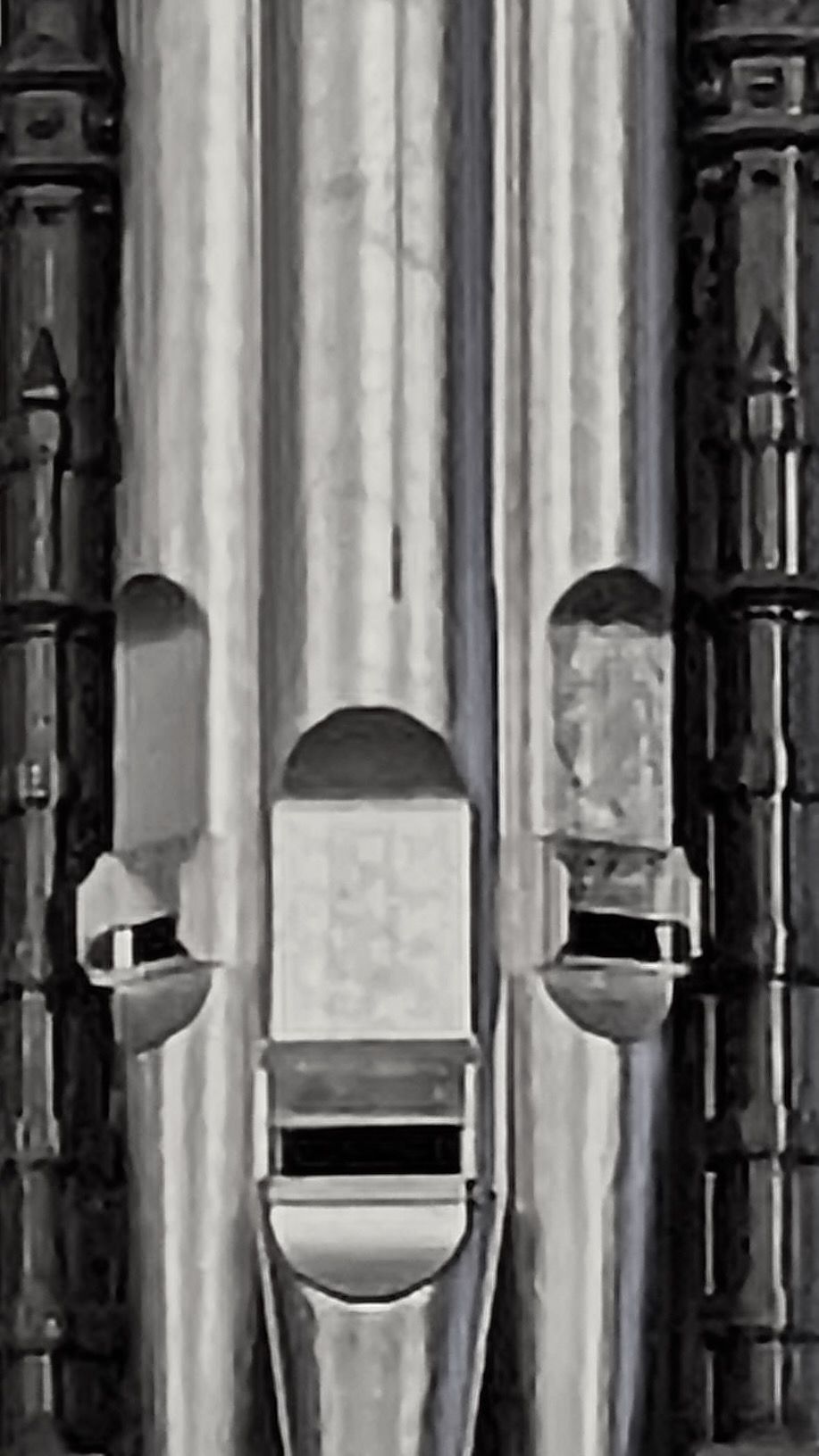 Organ pipes appear in black and white.