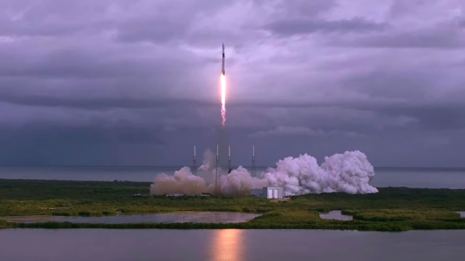A SpaceX rocket launches into a cloudy Florida sky