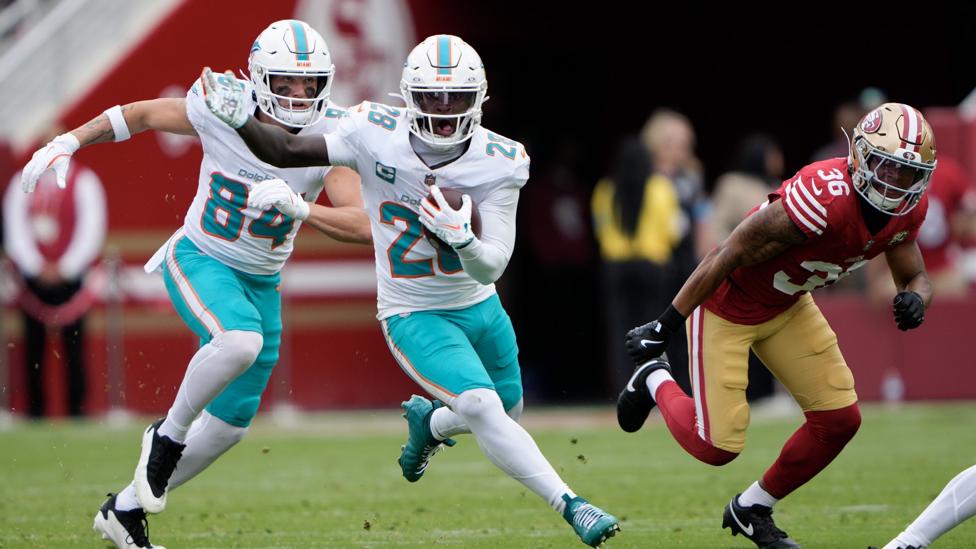 Two football players running.