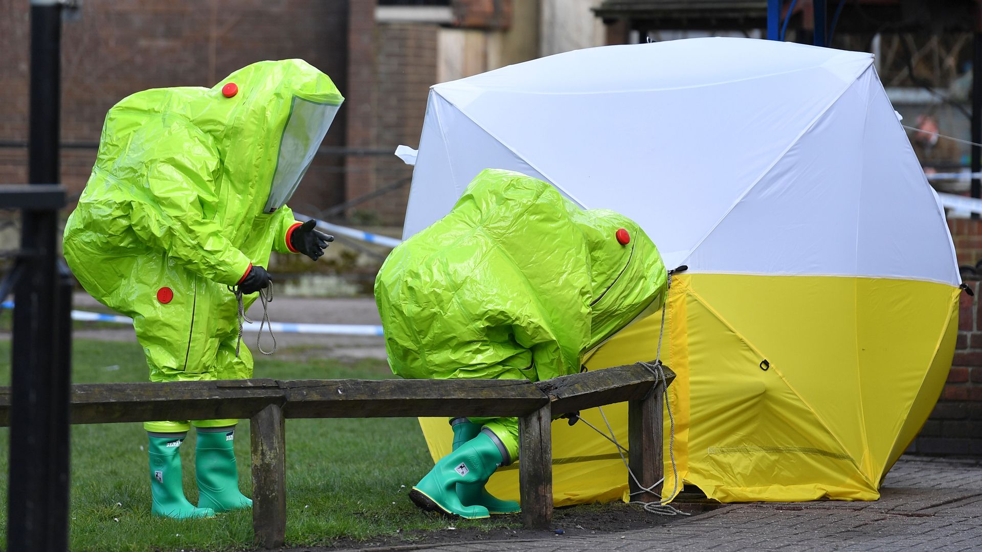 Emergency services members in biohazard encapsulated suits encasing the poisoning scene in a tent in March 2018.