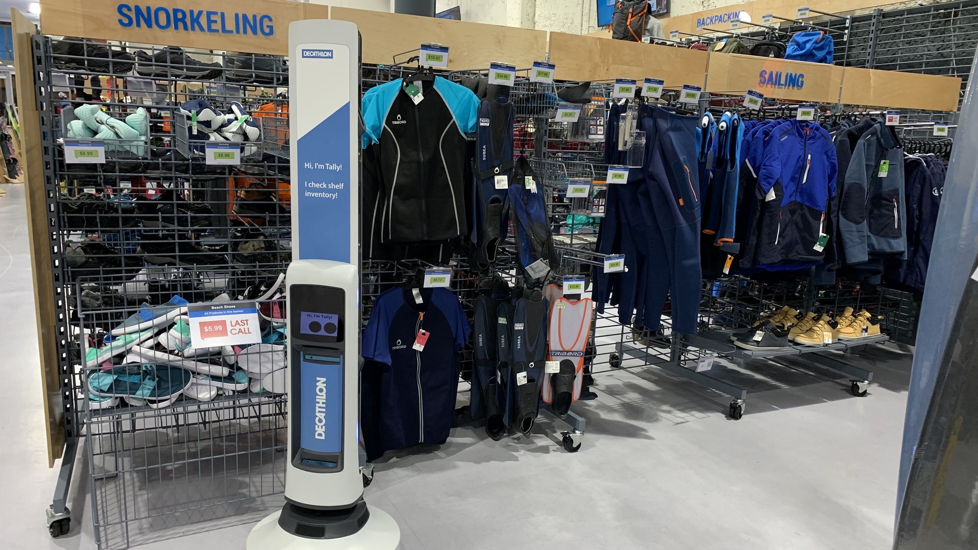 Photo of a tall, skinny robot in a retail store