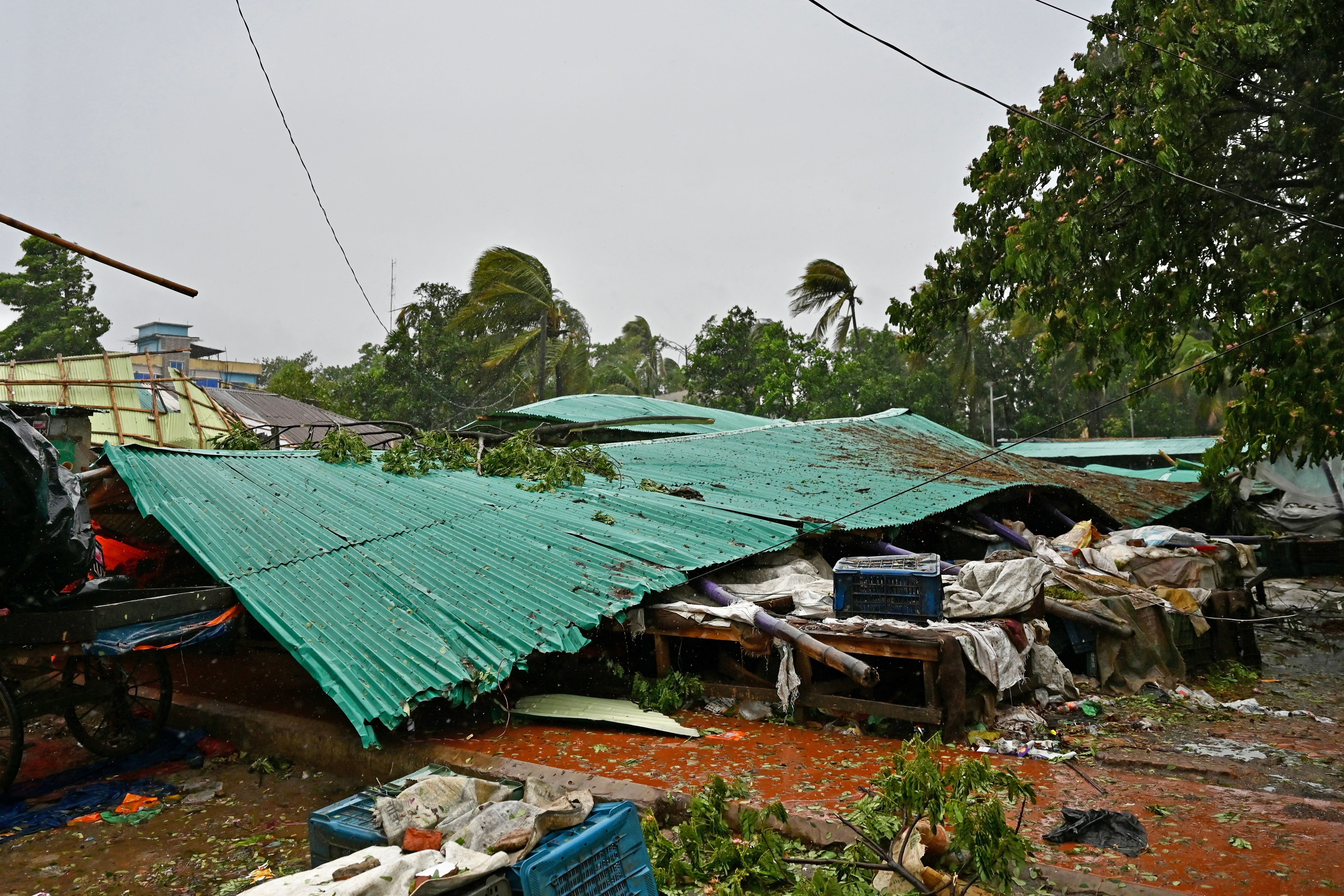 A damaged market is pictured in Teknaf on May 14, 2023, after the cyclone Mocha's landfall. Cyclone Mocha began to crash ashore at the Bangladesh-Myanmar border on May 14