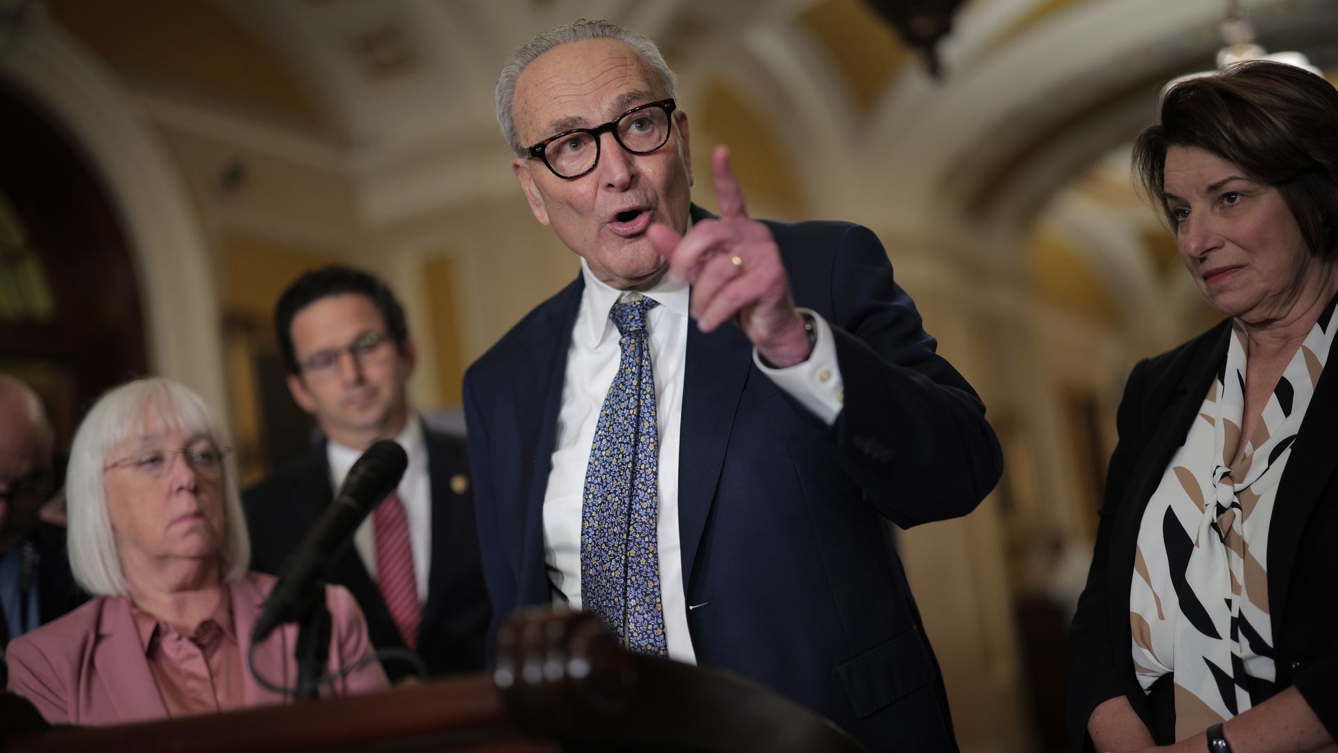 Senate Minority Leader Charles Schumer (D-NY) (C) talks to reporters following the weekly Senate Democratic policy luncheon at the U.S. Capitol