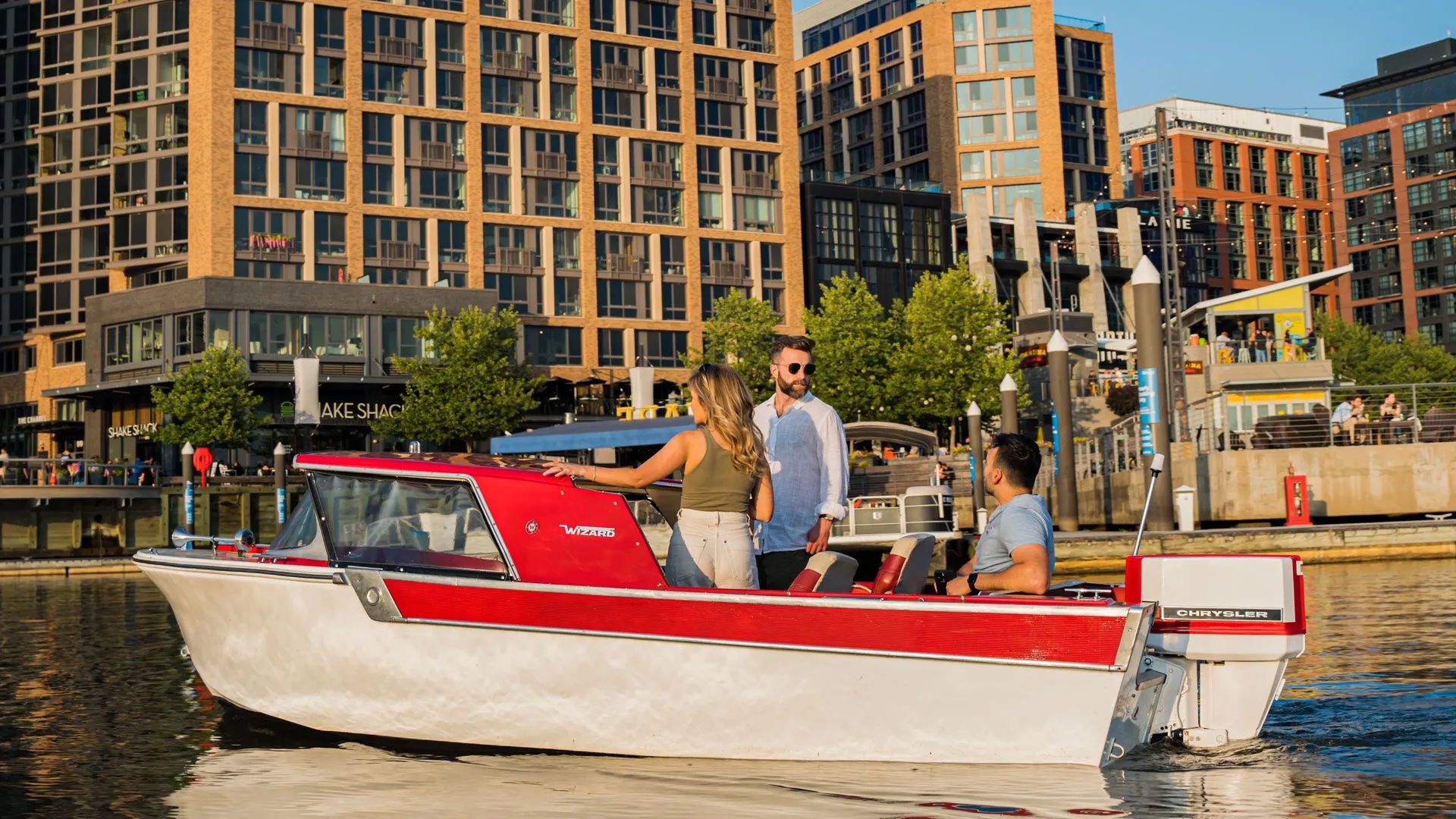 Retro electric boats for rent at The Wharf. Photo courtesy of SeaSuite