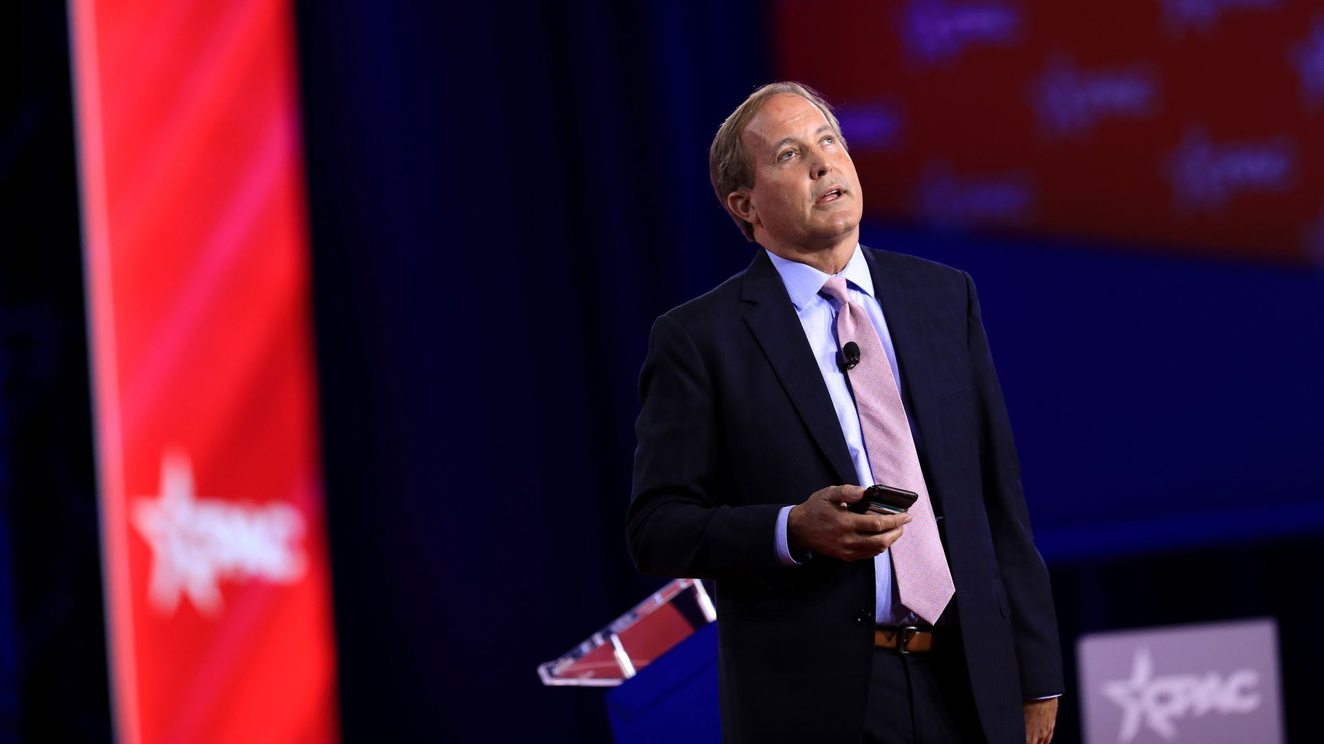 Ken Paxton photographed on a stage