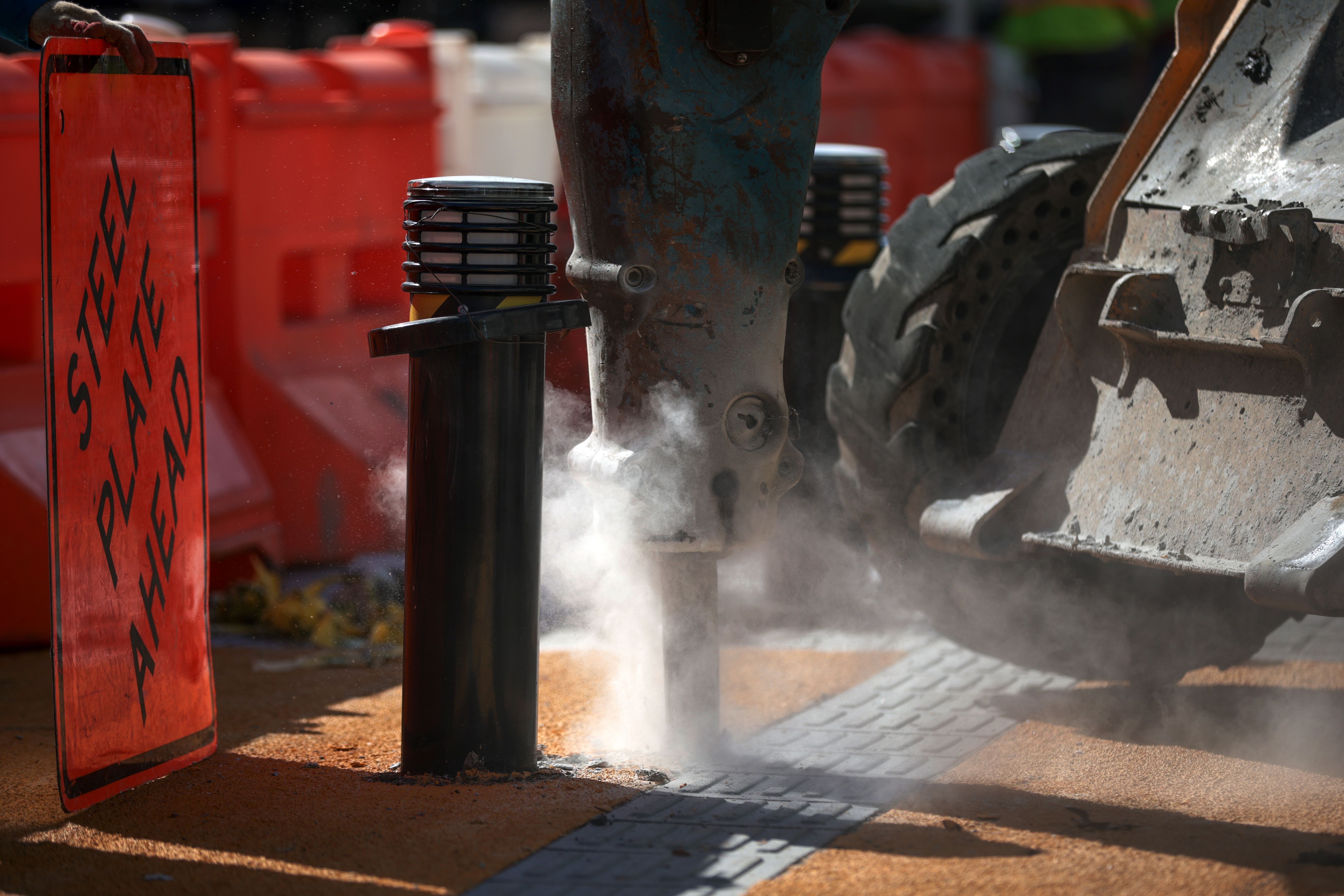 A jackhammer machine begins construction on the plaza 