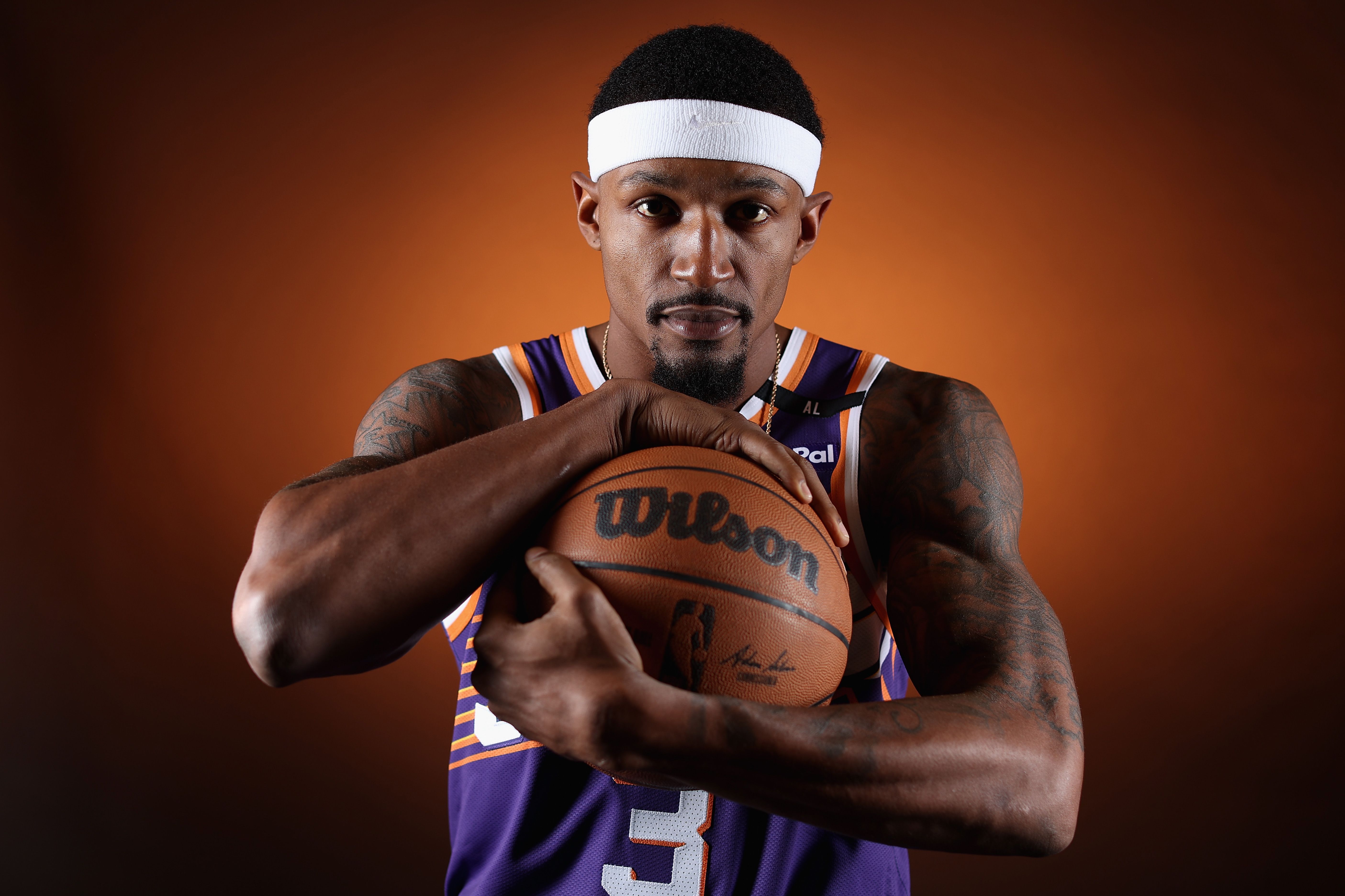 A basketball player posing for a photo. 