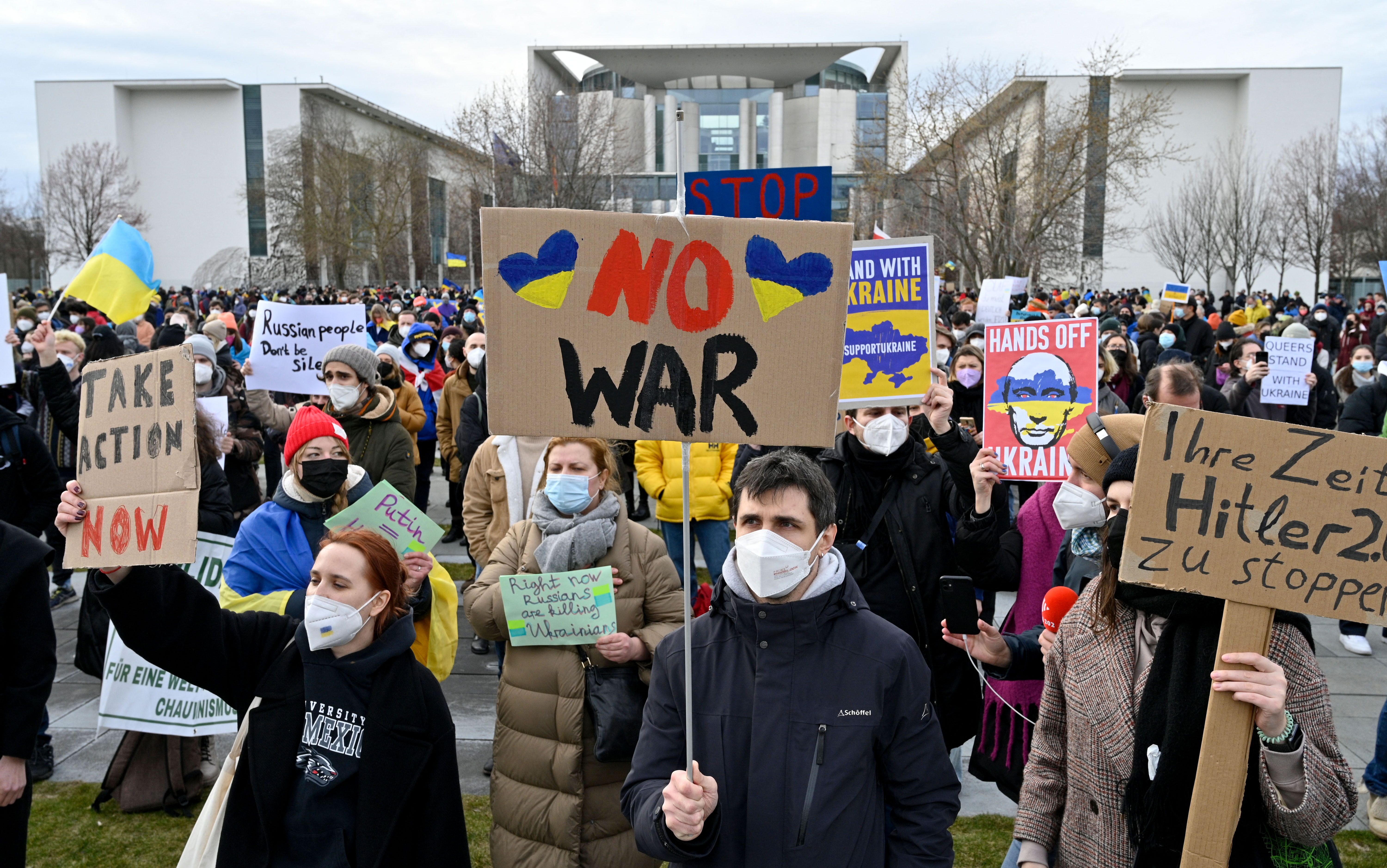 People protest against Russia's invasion of Ukraine on February 24, 2022 in front of the Chancellery in Berlin