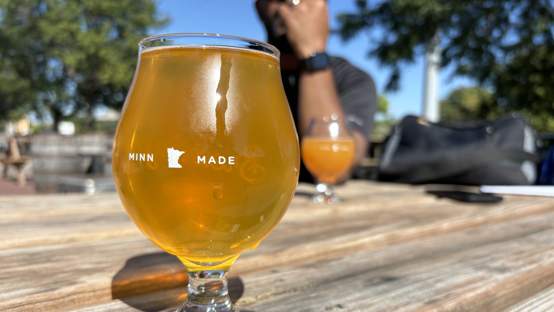 A beer on a picnic table