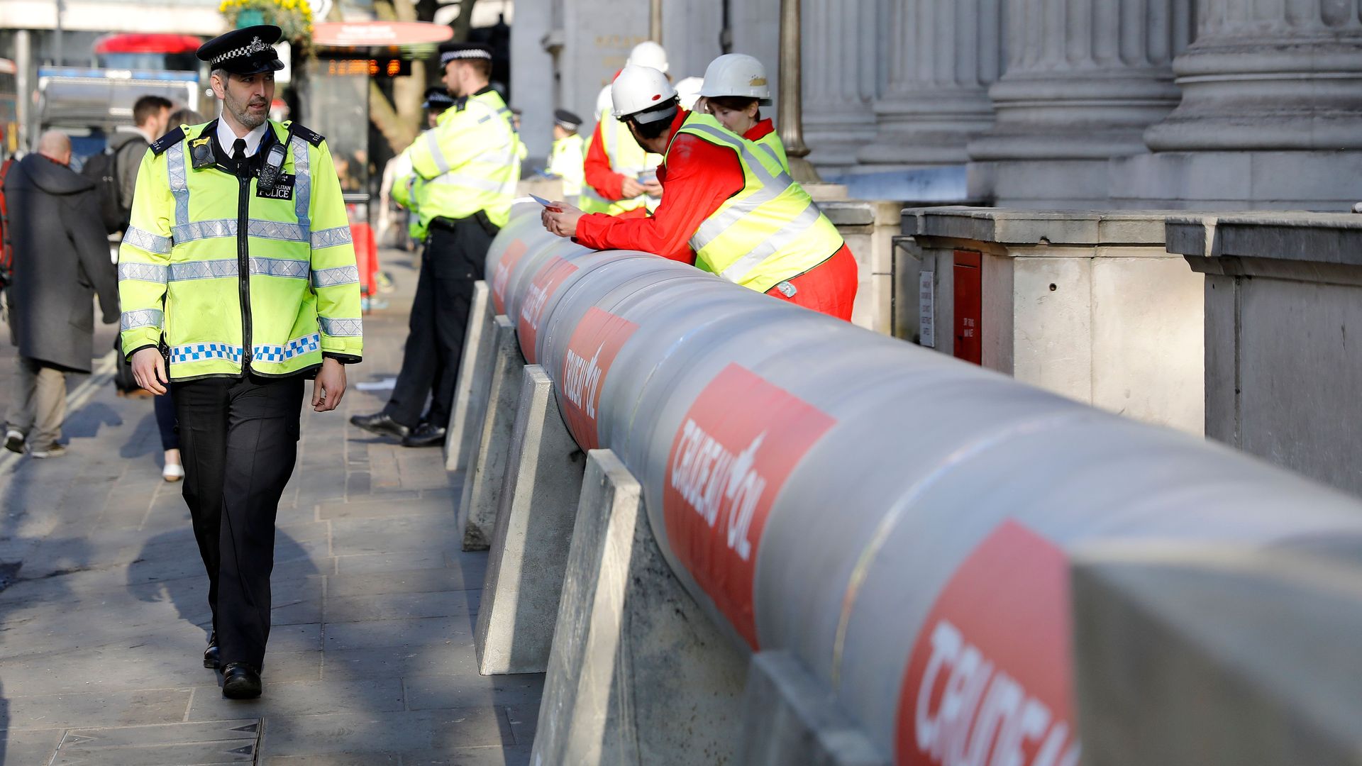 Photo of protestors against the TransMountain pipeline blocking an embassy in Canada with a mock pipeline