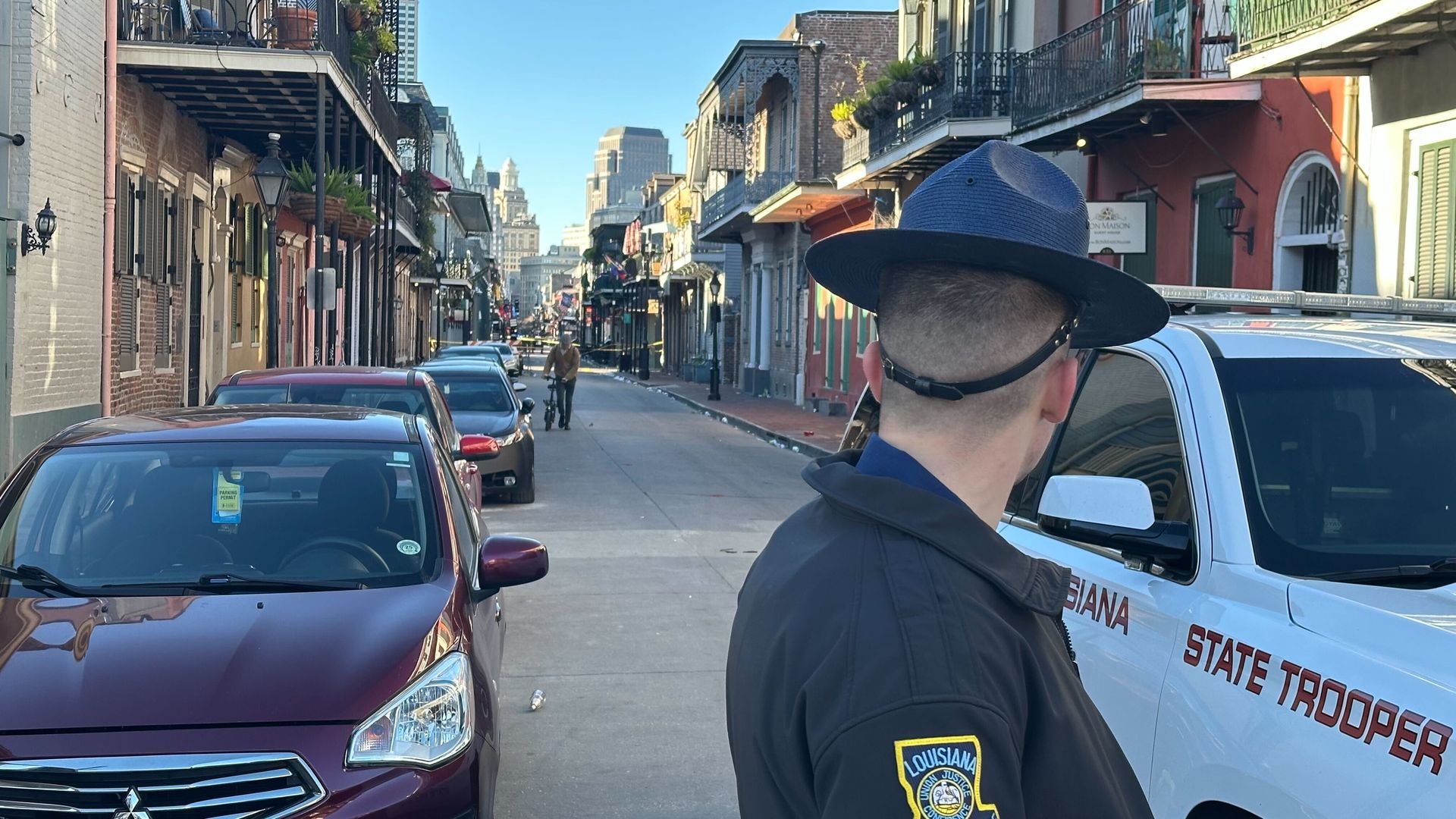 A Louisiana State Police trooper looks down Bourbon Street.