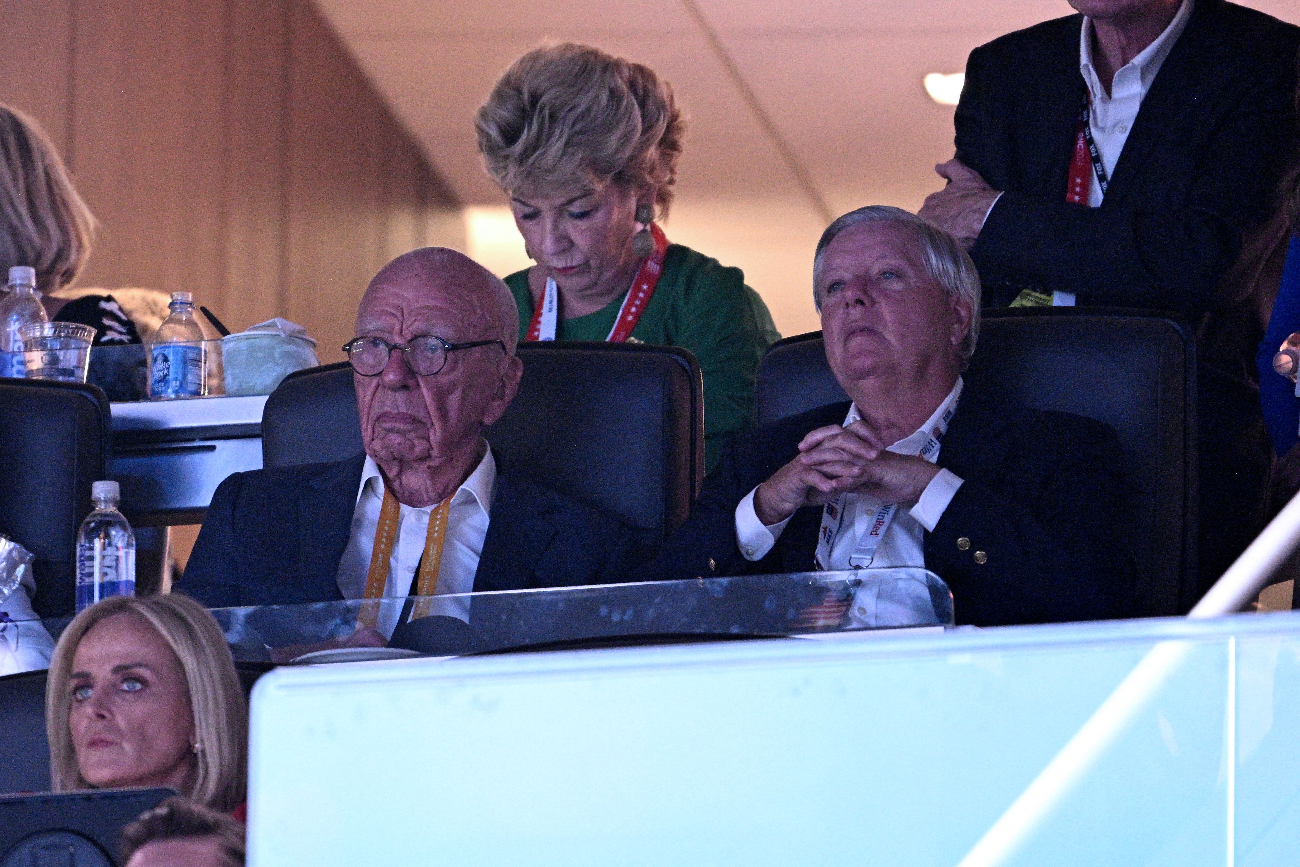 Rupert Murdoch sits with Sen. Lindsey Graham in a suite at the convention last night.