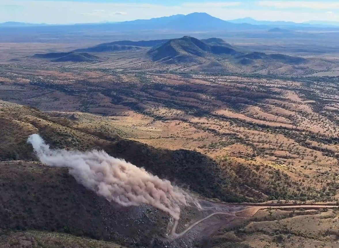 An explosion in a desert mountain range.