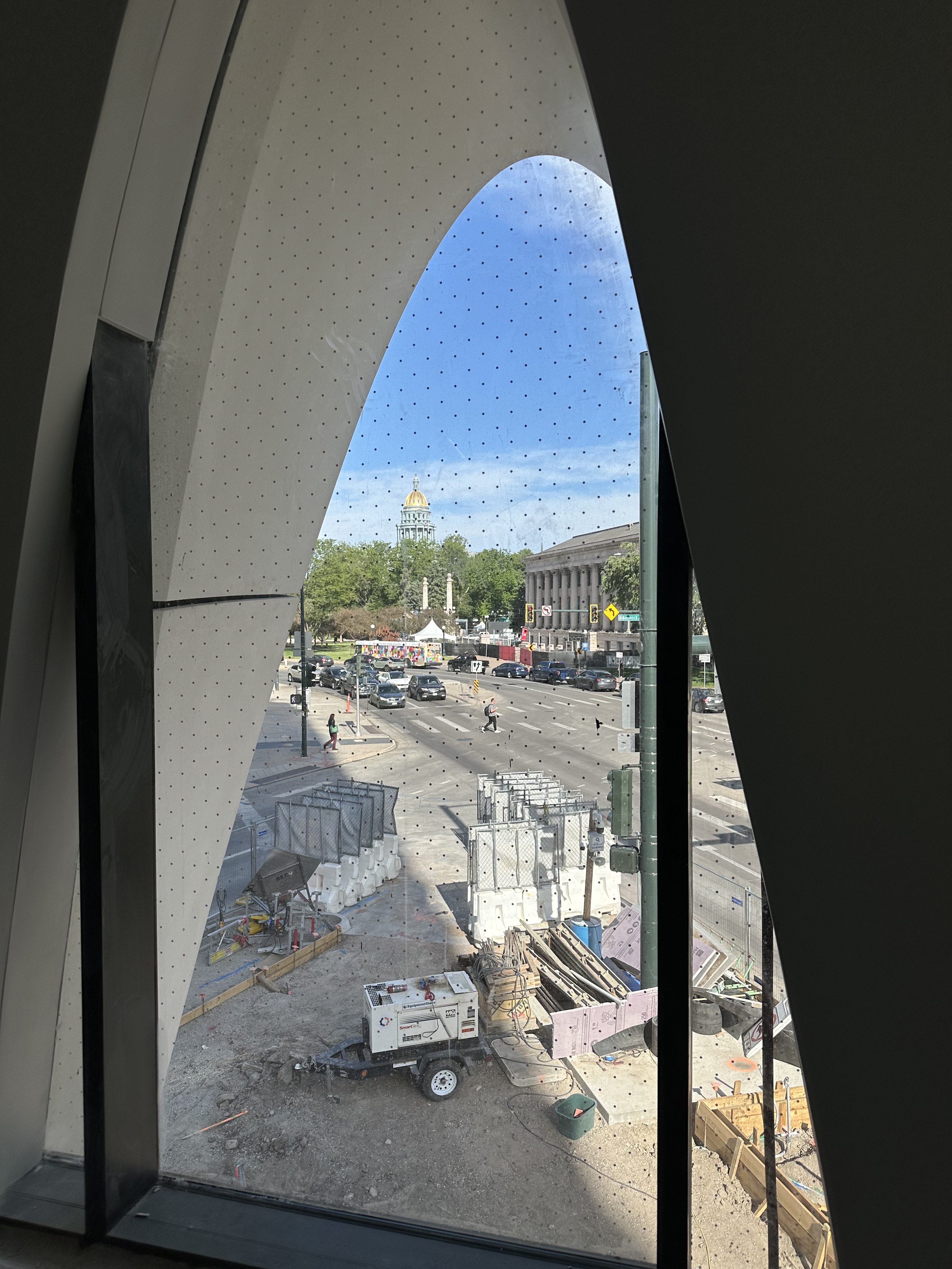 The hotel features 65 different window shapes including this arch on the second floor. The windows look like black marks on an Aspen tree and provide shade to the rooms inside.