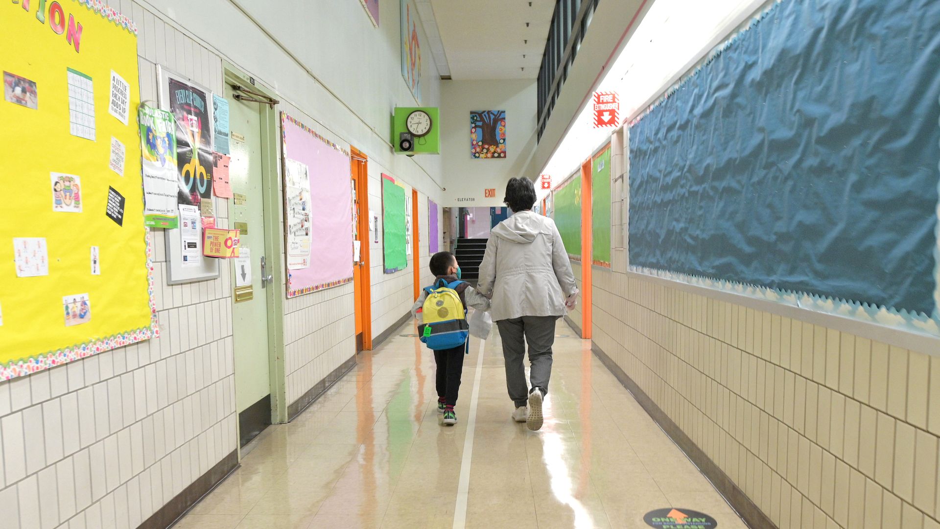 Picture of a student being walked to class