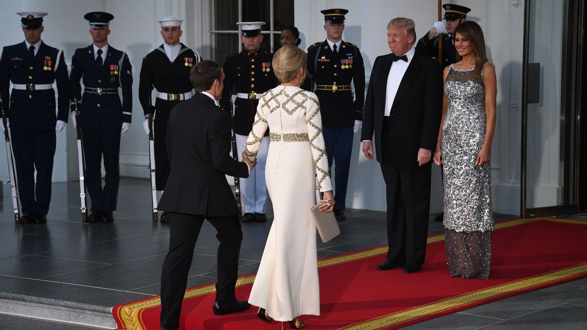 US President Donald Trump and First Lady Melania Trump welcome French President Emmanuel Macron and his wife, Brigitte Macron arriving at the White House. 