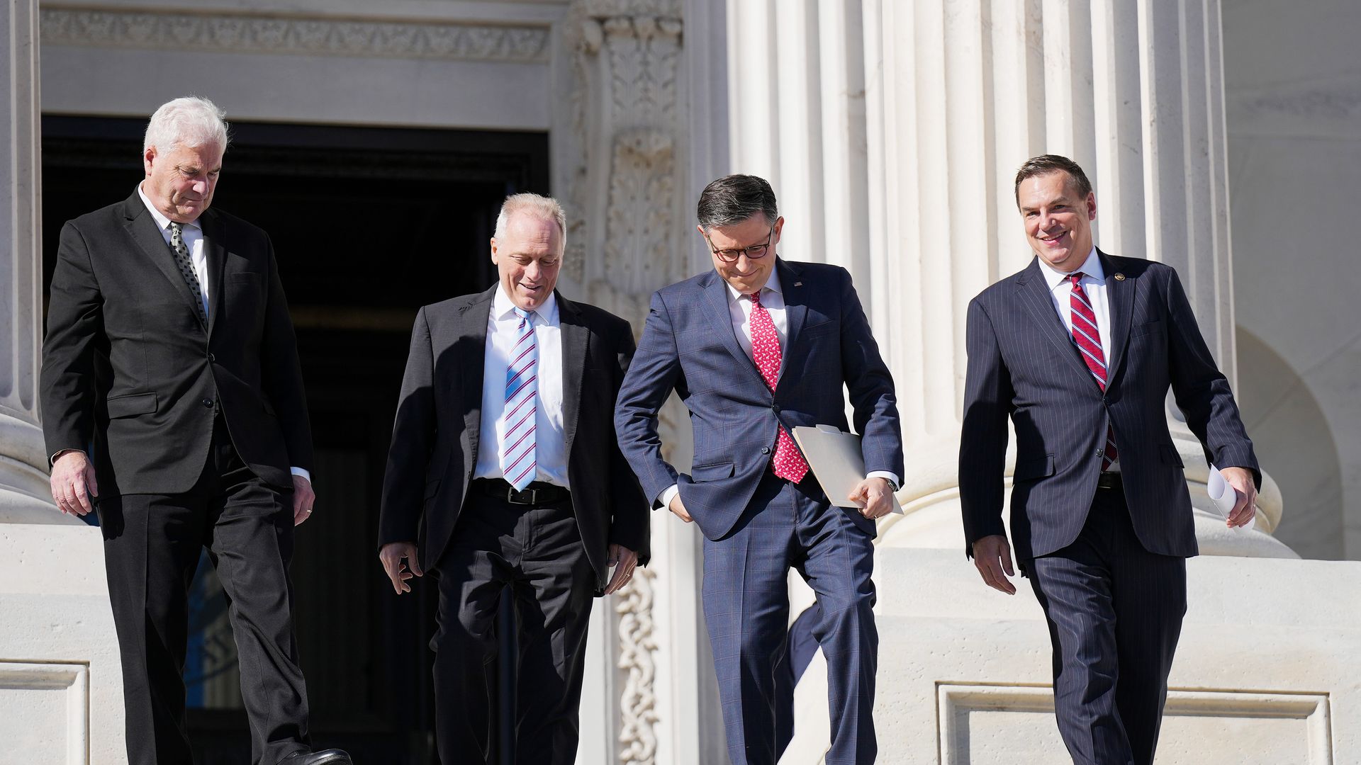 Speaker Mike Johnson, flanked by members of his leadership team, heads to a news conference outside of the U.S. Capitol on Nov. 12, 2024.