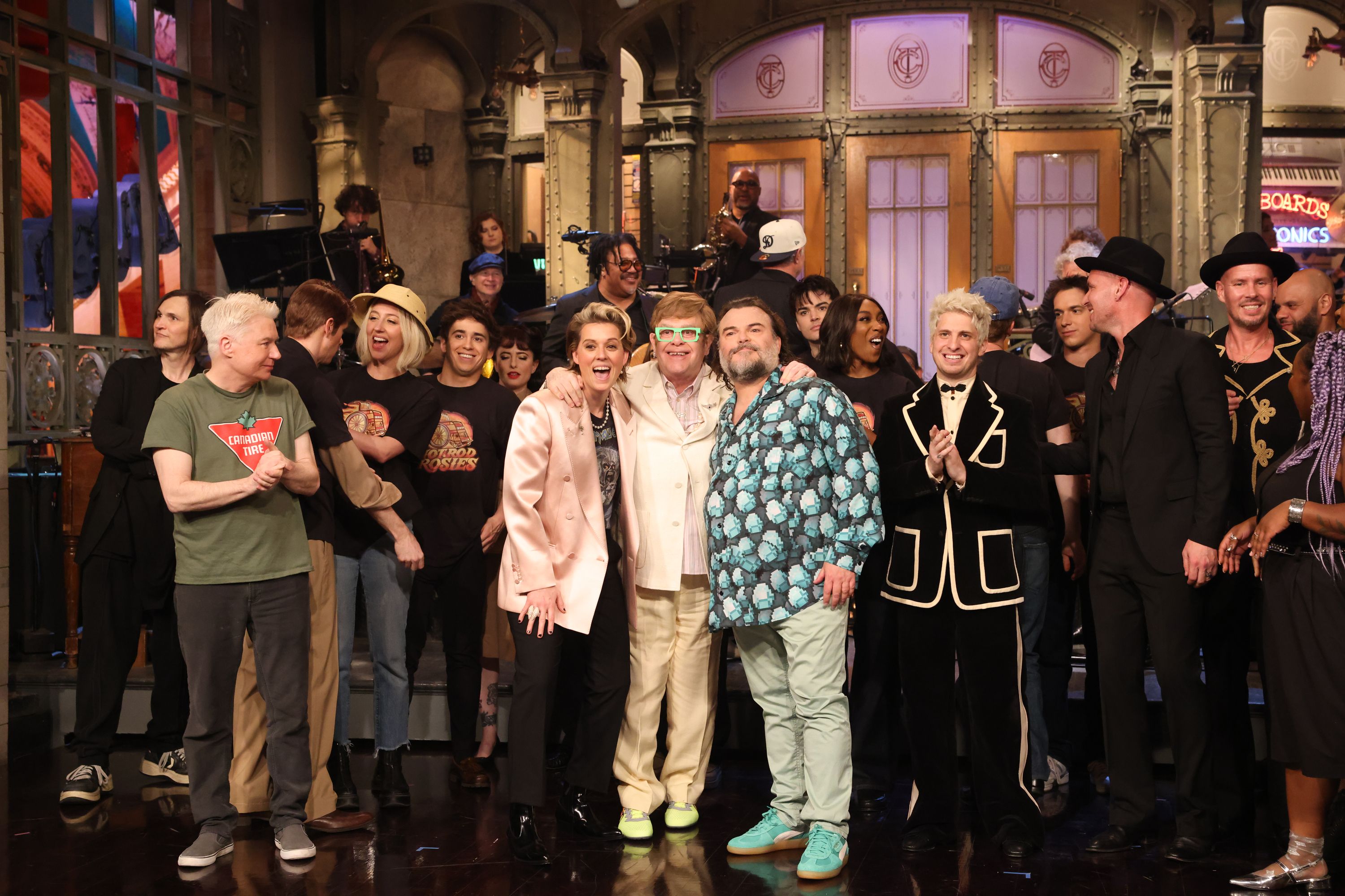 SATURDAY NIGHT LIVE -- Episode 1880 -- Pictured: (l-r) Special guest Mike Myers, Heidi Gardner, Marcello Hernández, musical guests Brandi Carlile & Elton John, and host Jack Black during Goodnights & Credits on Saturday, April 5, 2025 -- (Photo by: Will Heath/NBC via Getty Images)