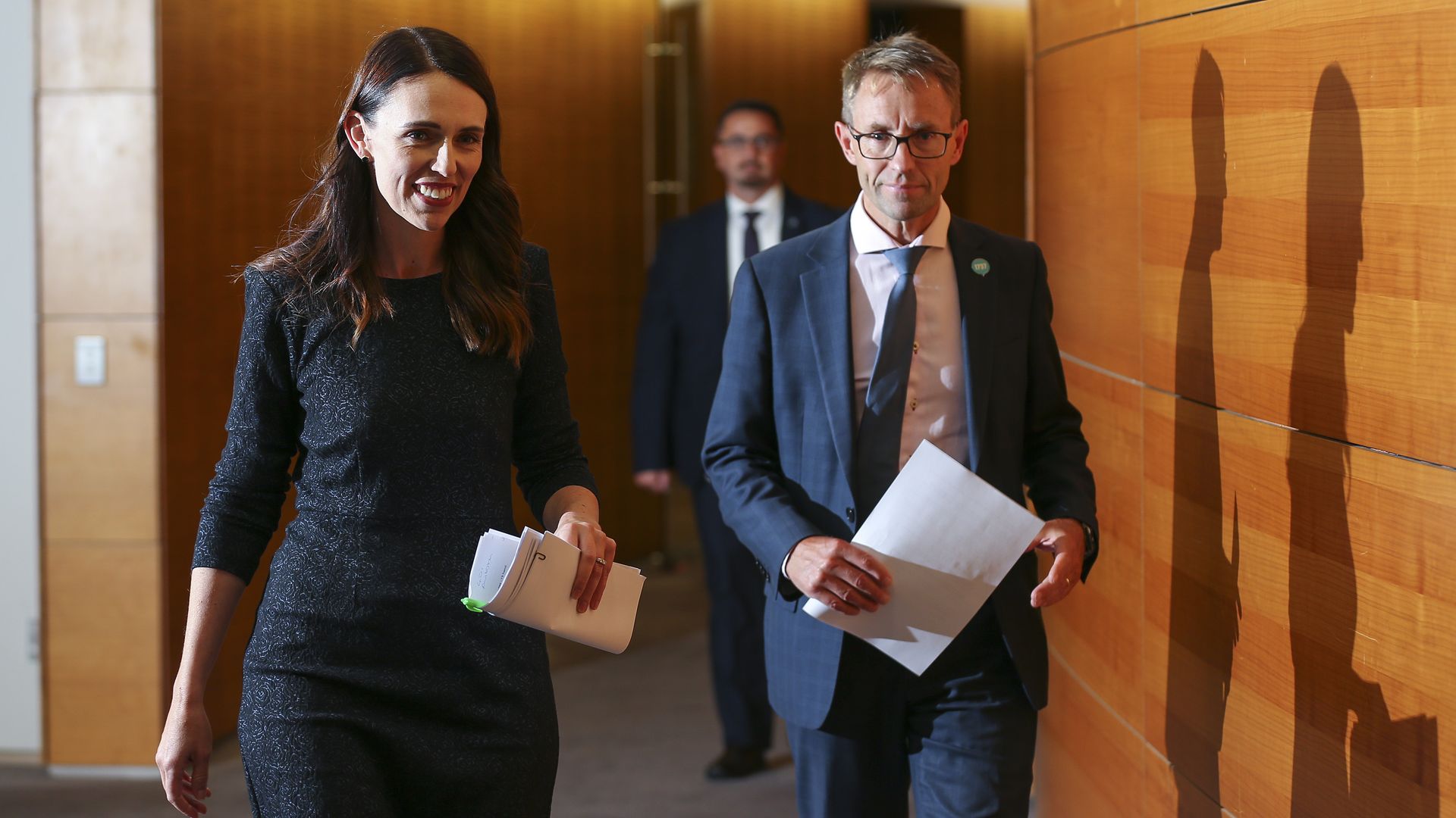 Prime Minister Jacinda Ardern and Director-General of Health Dr Ashley Bloomfield arrive at a press conference at Parliament on February 15, 2021 in Wellington, New Zealand. 