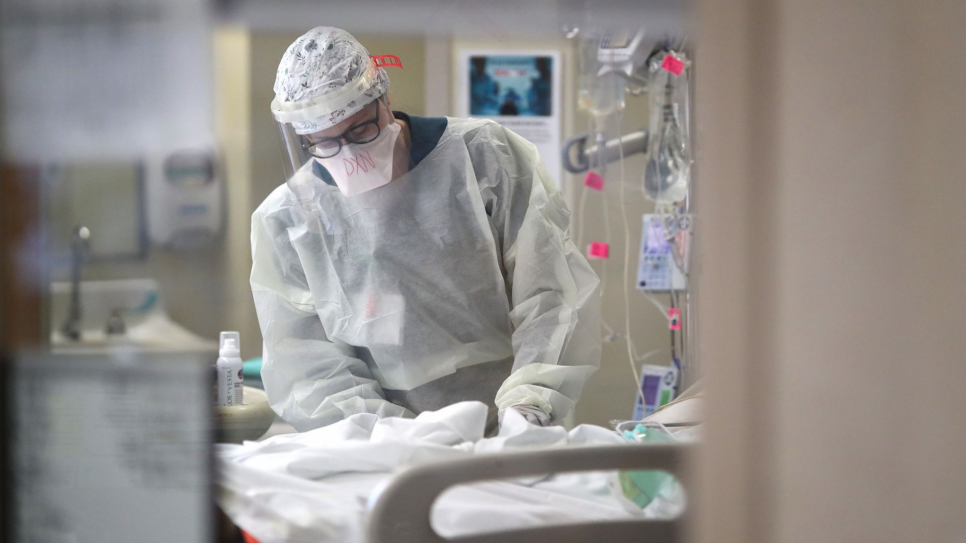 A nurse treats a coronavirus patient