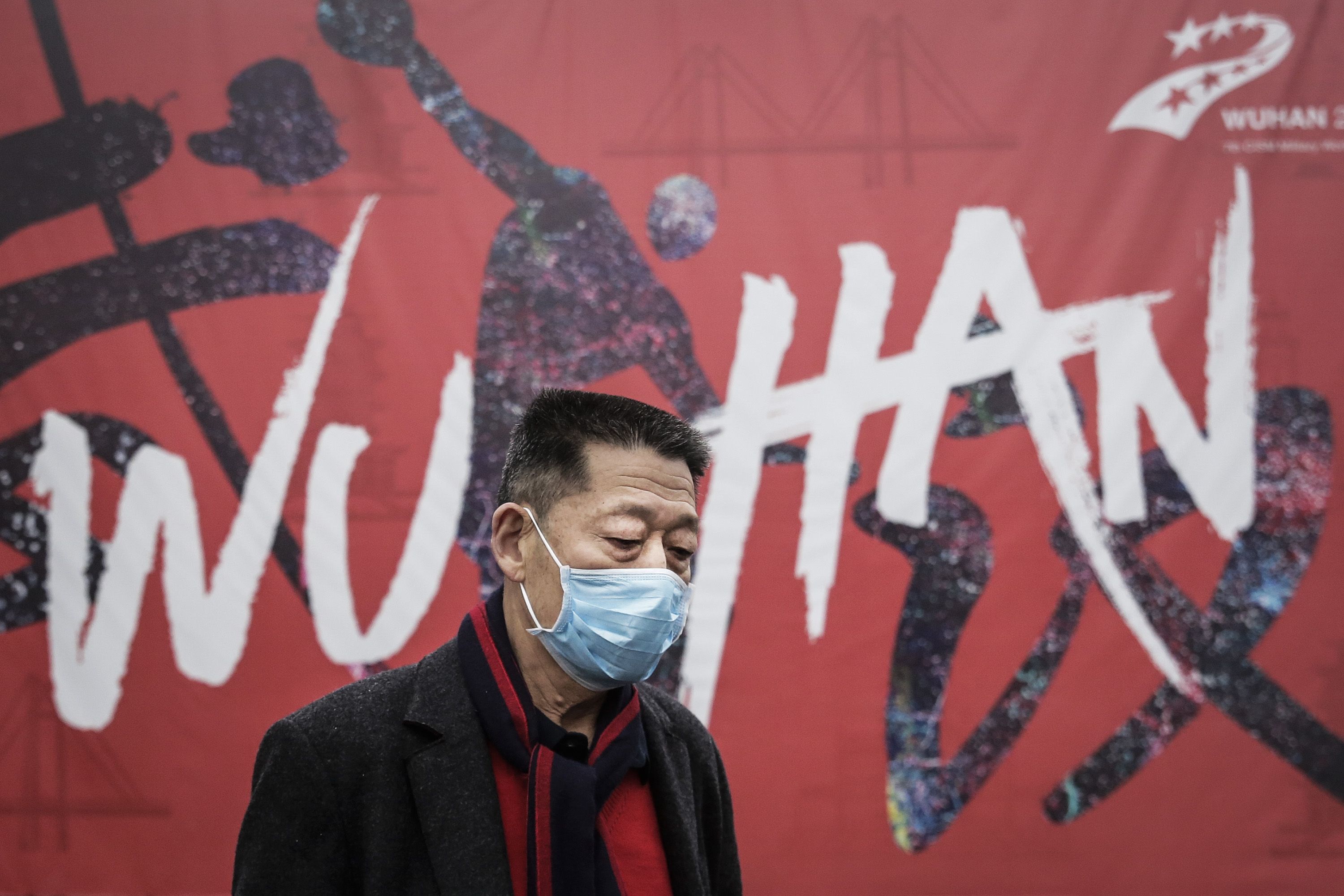  A man wears a mask while walking in the street on January 22, 2020 in Wuhan, Hubei province, China. 