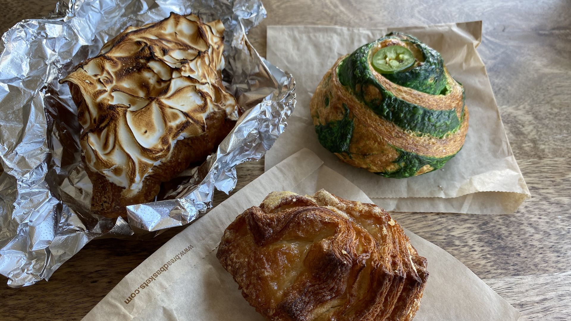 Three pastries arranged on a table.
