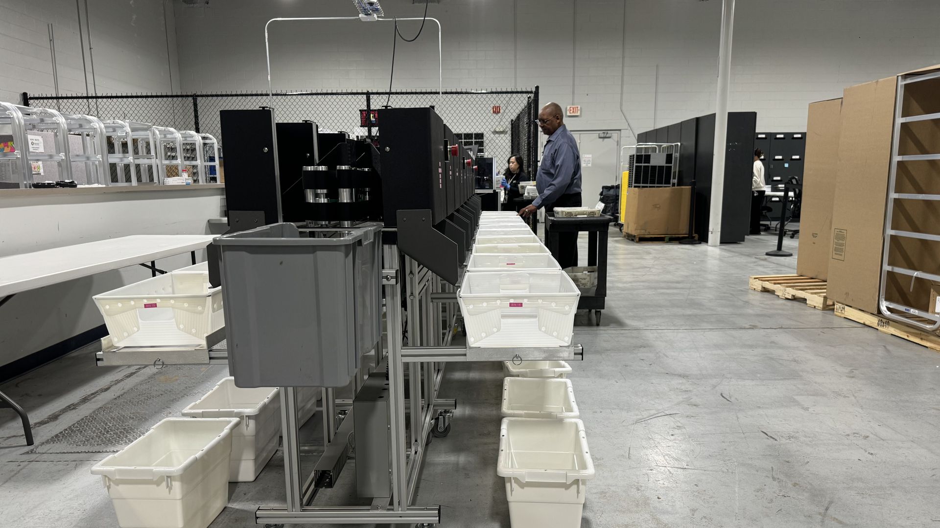 A poll worker sorts absentee ballots at a polling station in Gwinnett County, Georgia, in preparation for the US presidential election.