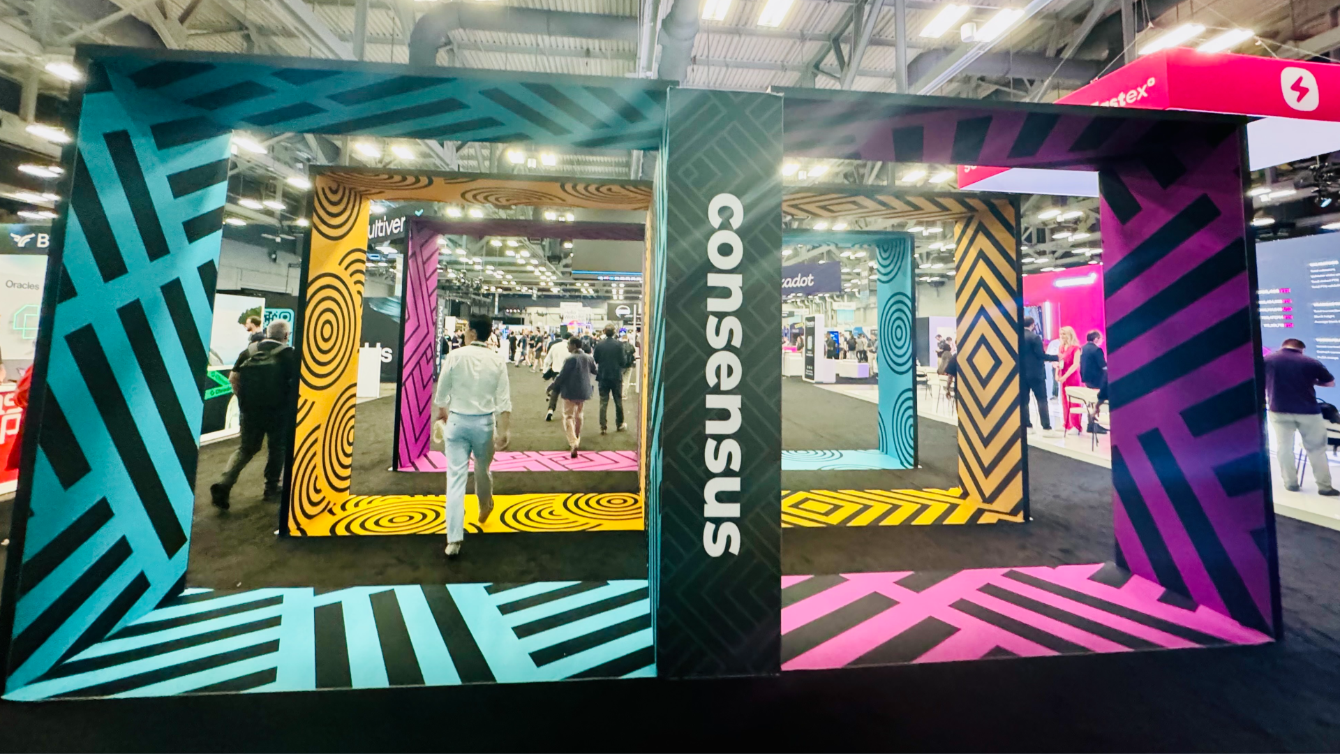 People walking through the entrance of the exhibit hall at Consensus 2024 in Austin, Texas.