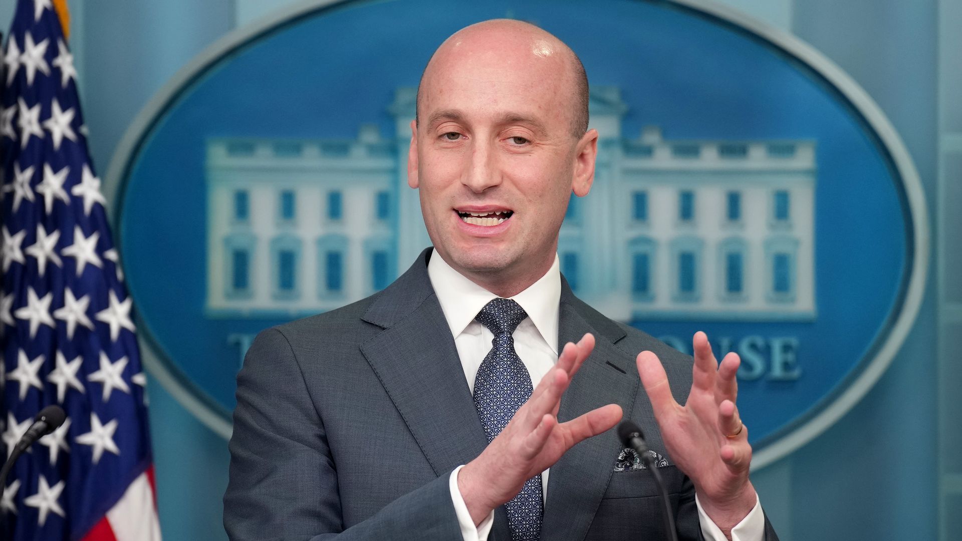 Stephen Miller gestures as he speaks in the WH press briefing room.