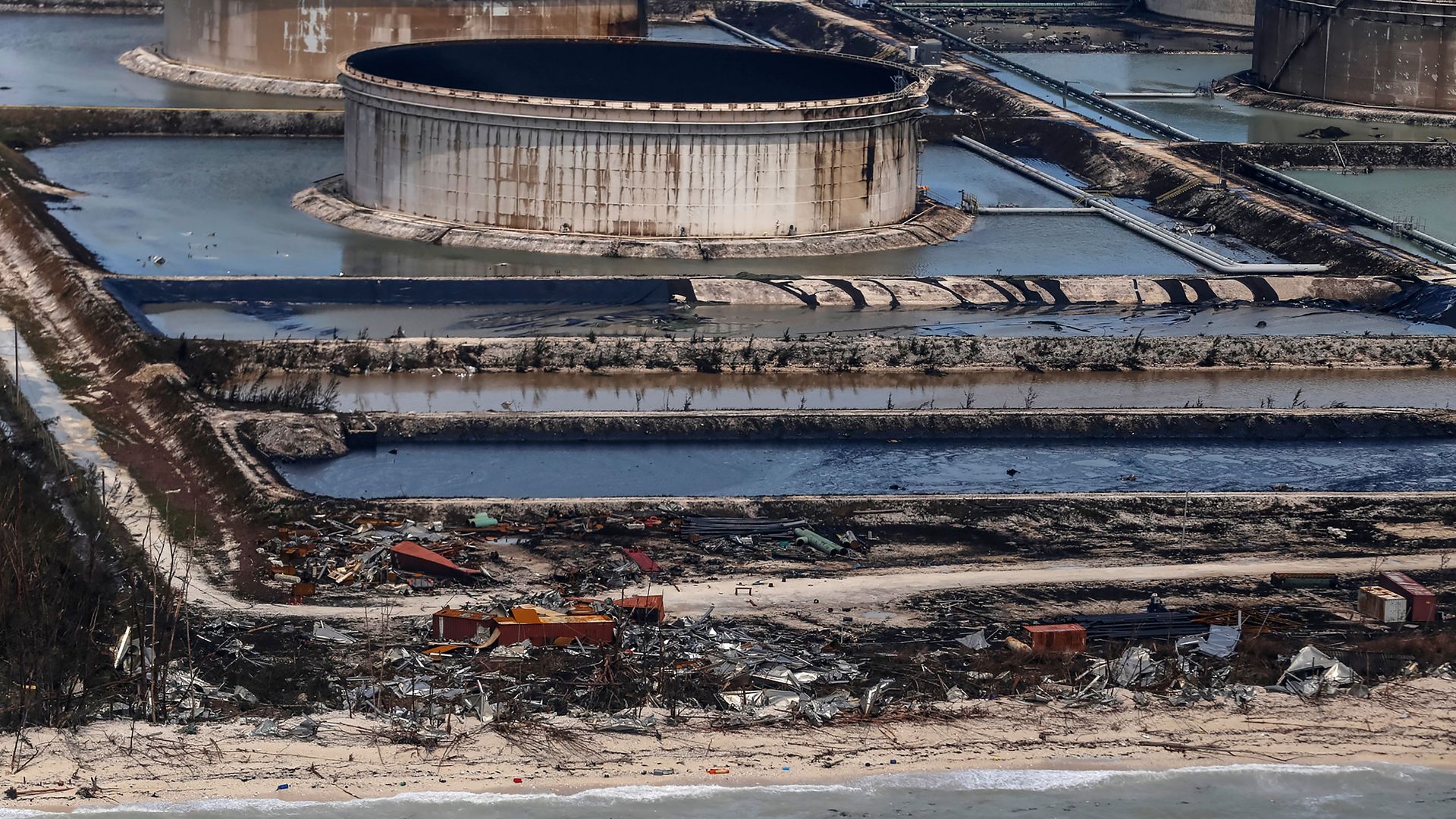 In this image, oil from a large cylinder leaks into the surrounding water