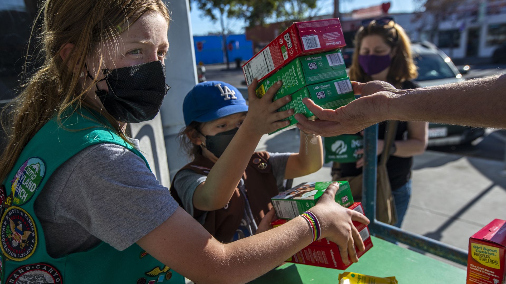 Girl Scouts with cookie boxes