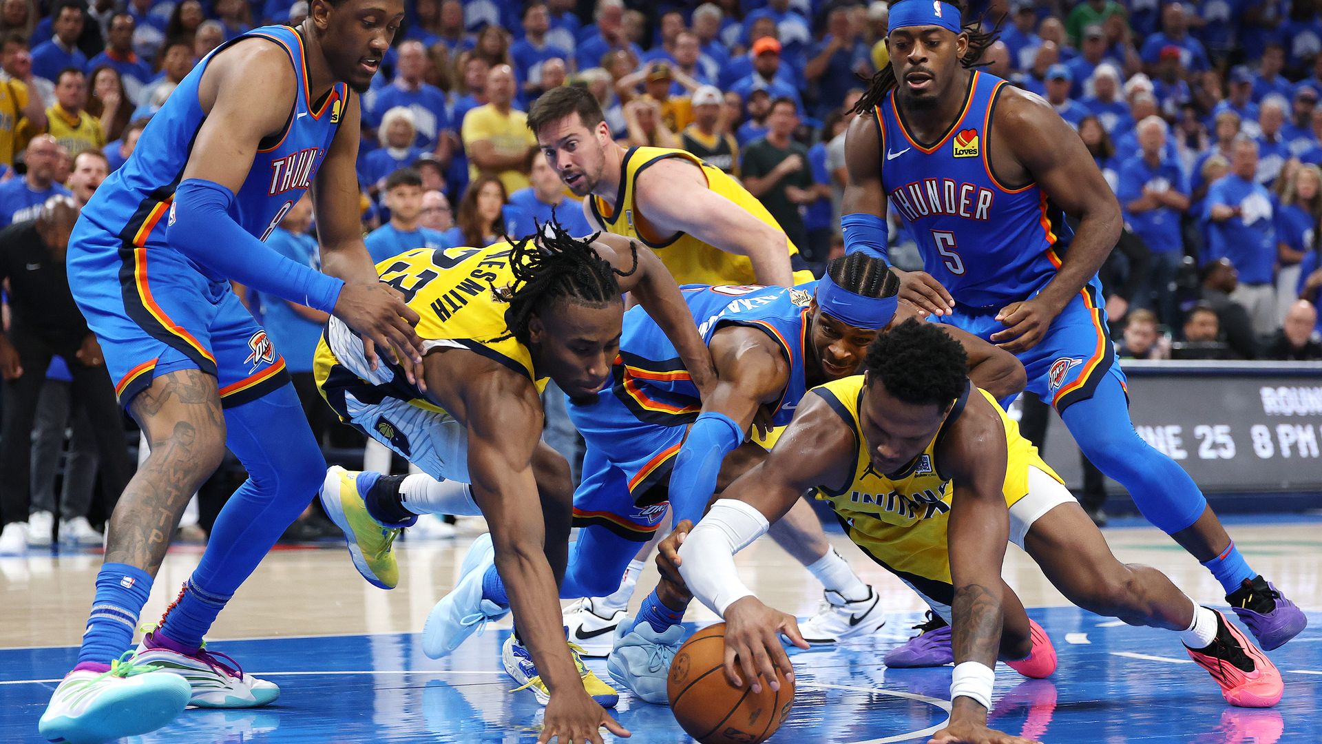 Aaron Nesmith #23 and Bennedict Mathurin #00 of the Indiana Pacers battle for the ball with Shai Gilgeous-Alexander #2 of the Oklahoma City Thunder during the fourth quarter in Game Seven of the 2025 NBA Finals at Paycom Center on June 22, 2025 in Oklahoma City, Oklahoma.