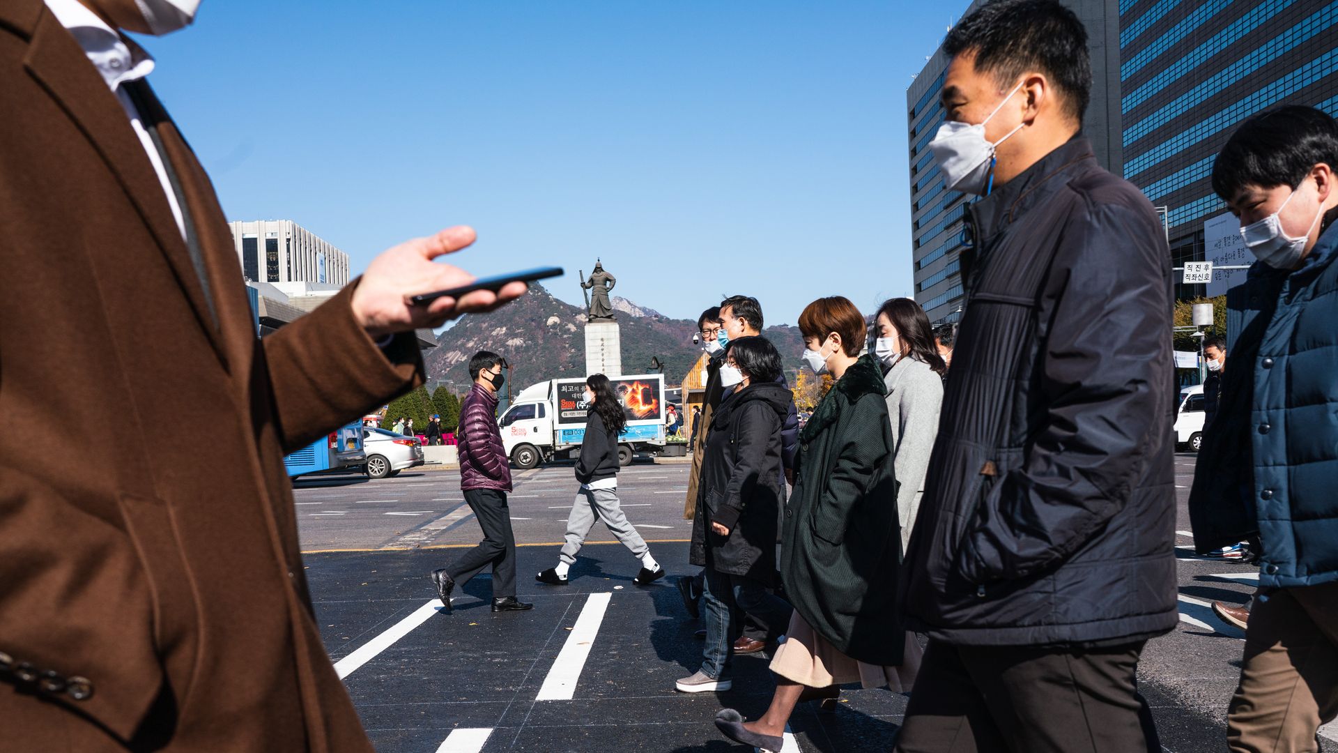 People walking in masks.