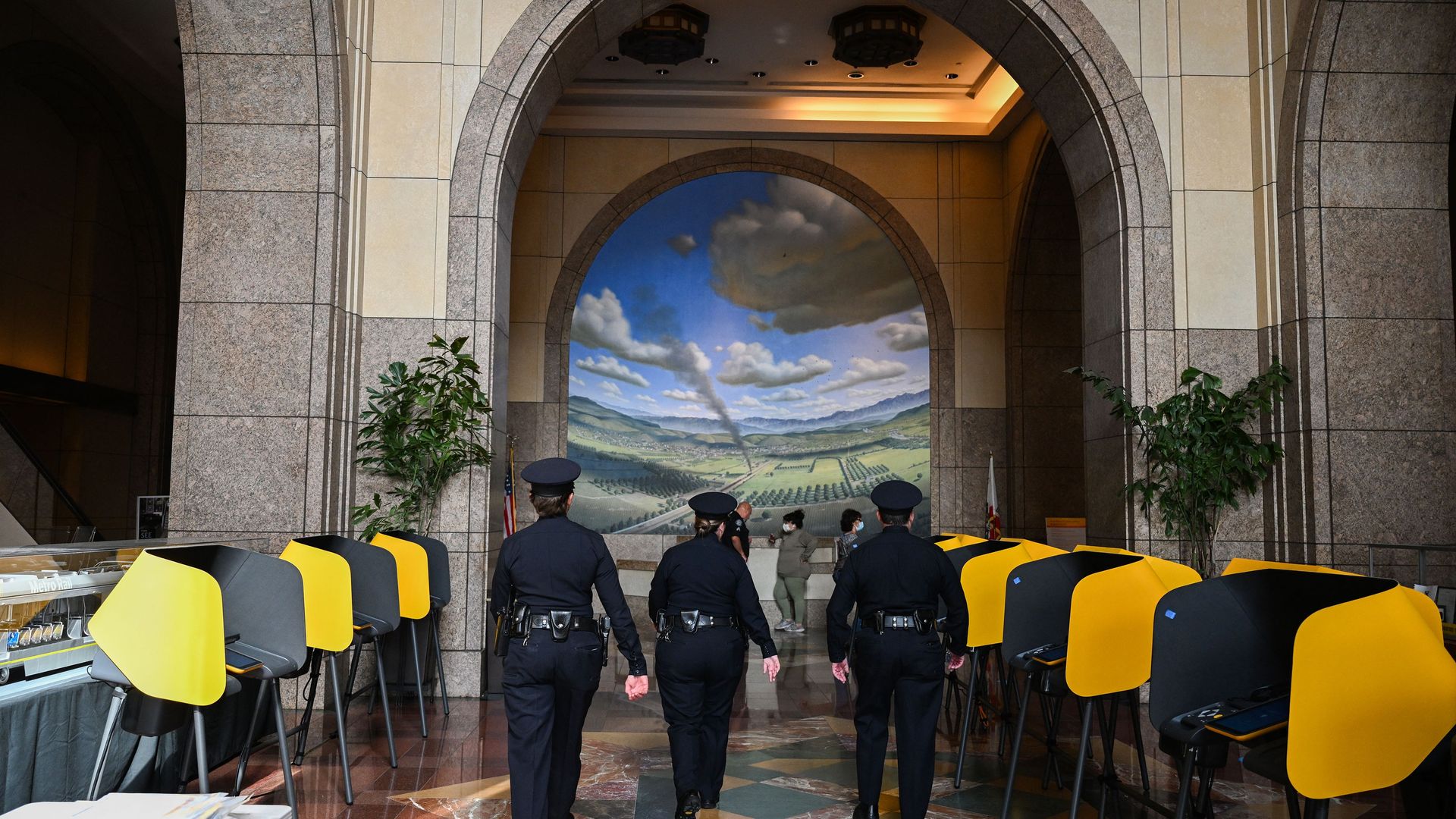 Police officers walk through a polling station during early voting ahead of the US midterm elections in Los Angeles, California.