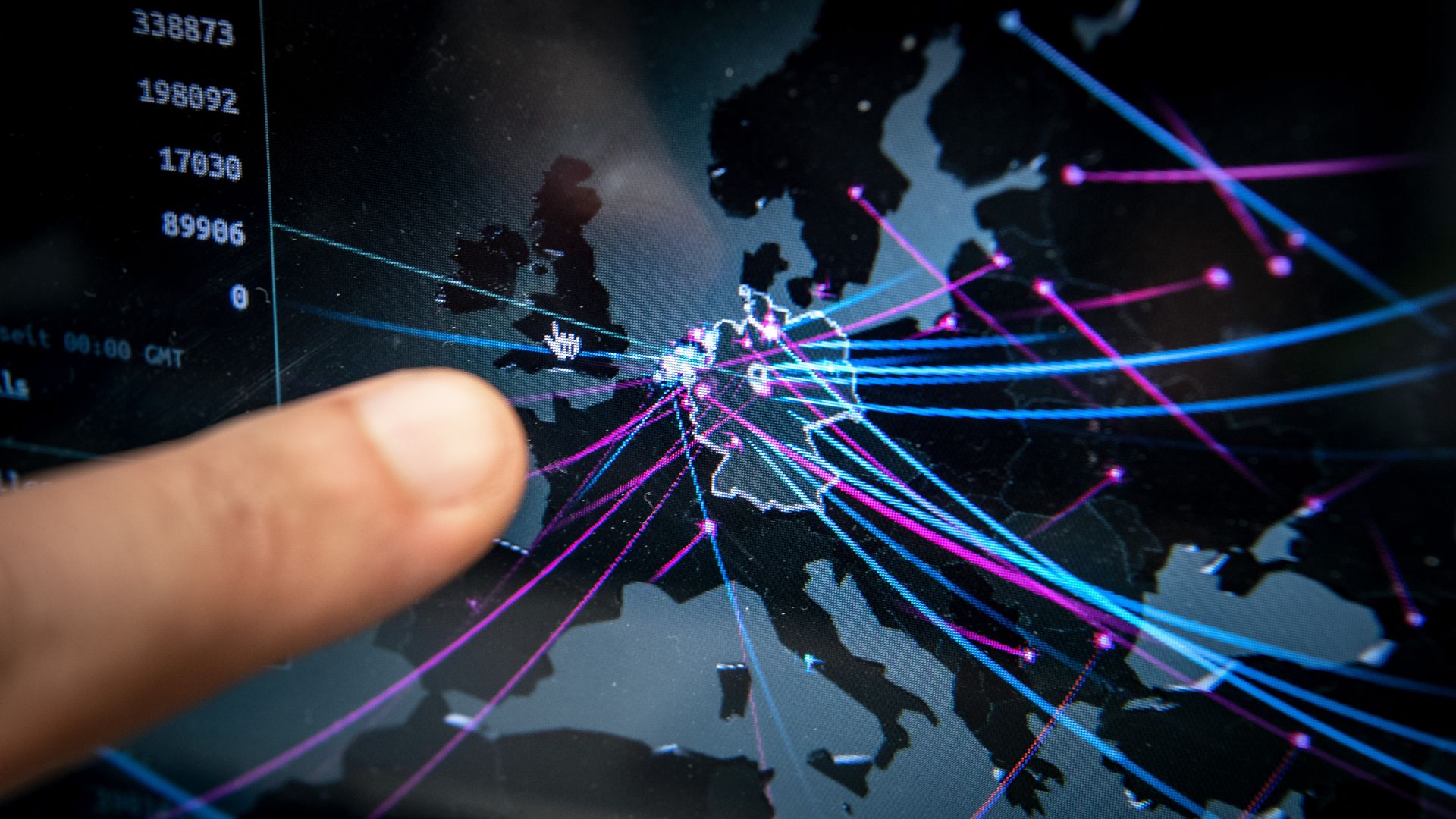 Photo of a man pointing to a map of Germany with incoming and outgoing lines