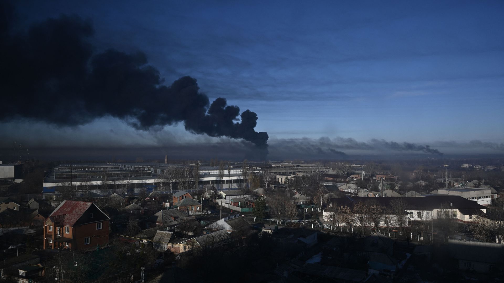 Black smoke rises from a military airport in Chuguyev near Kharkiv on February 24.